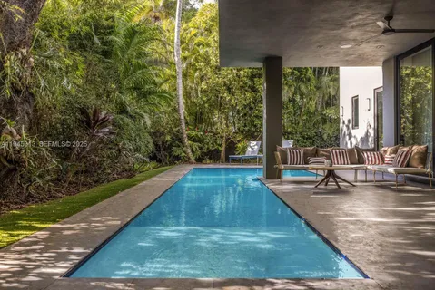 a view of swimming pool with chairs