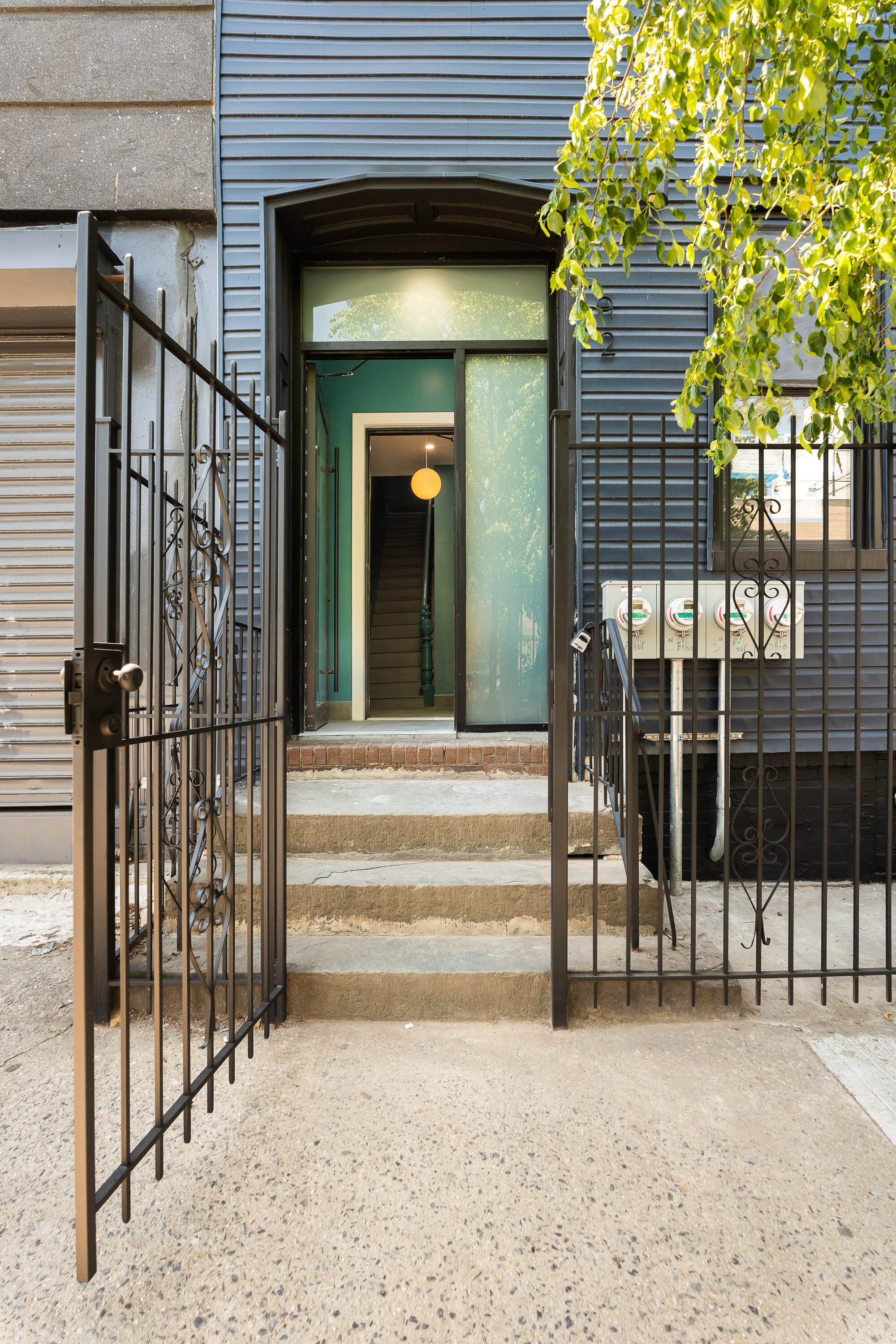 92 Wilson Avenue Brooklyn, NY 11237 - Photo 12 of 15 a view of a brick house with a large window