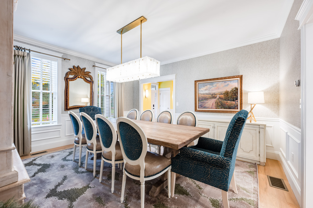 45 Washburn Avenue Needham, MA 02492 - Photo 4 of 23 a dining room with furniture a chandelier and wooden floor