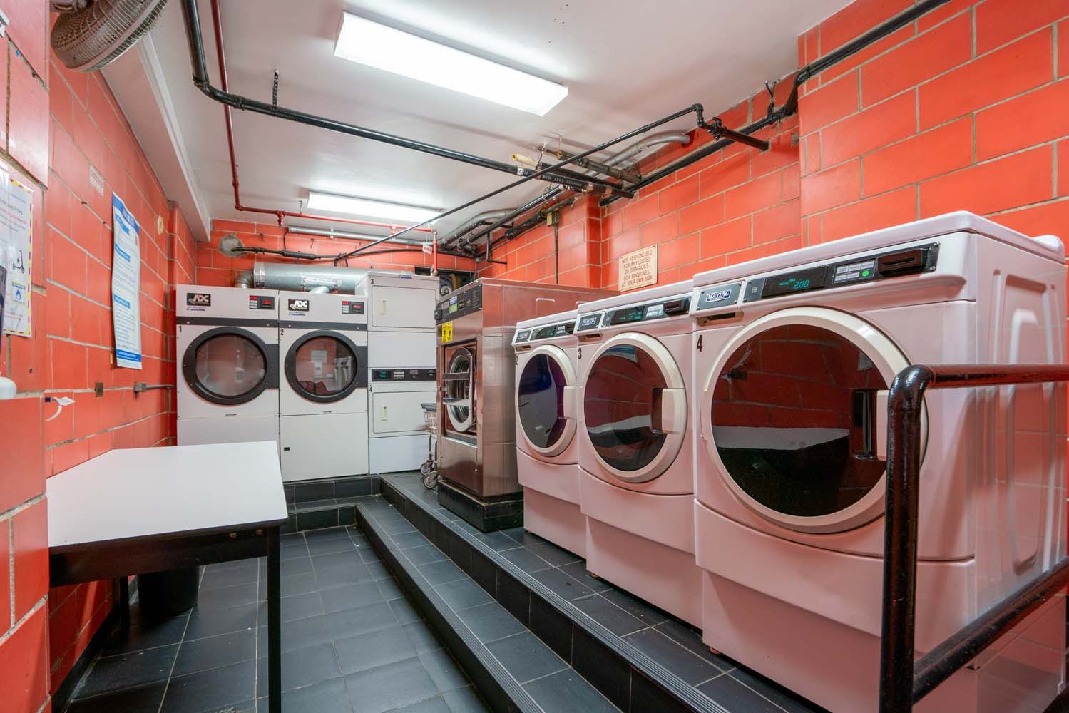 150 East 37th Street, Unit 10F Manhattan, NY 10016 - Photo 15 of 20 a utility room with dryer and washer