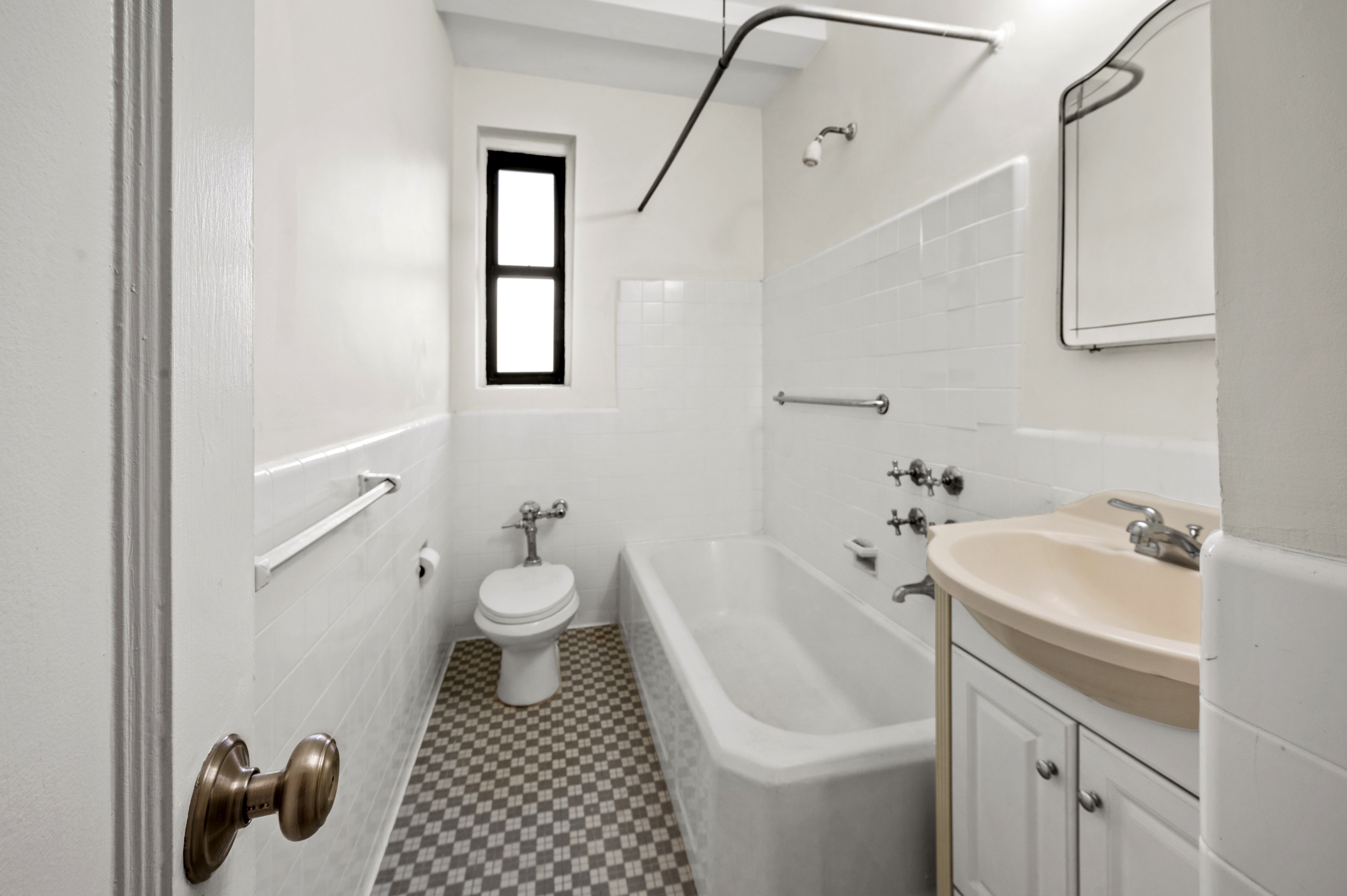 159-34 Riverside Drive West, Unit 3D Manhattan, NY 10032 - Photo 11 of 12 a bathroom with a sink toilet and shower