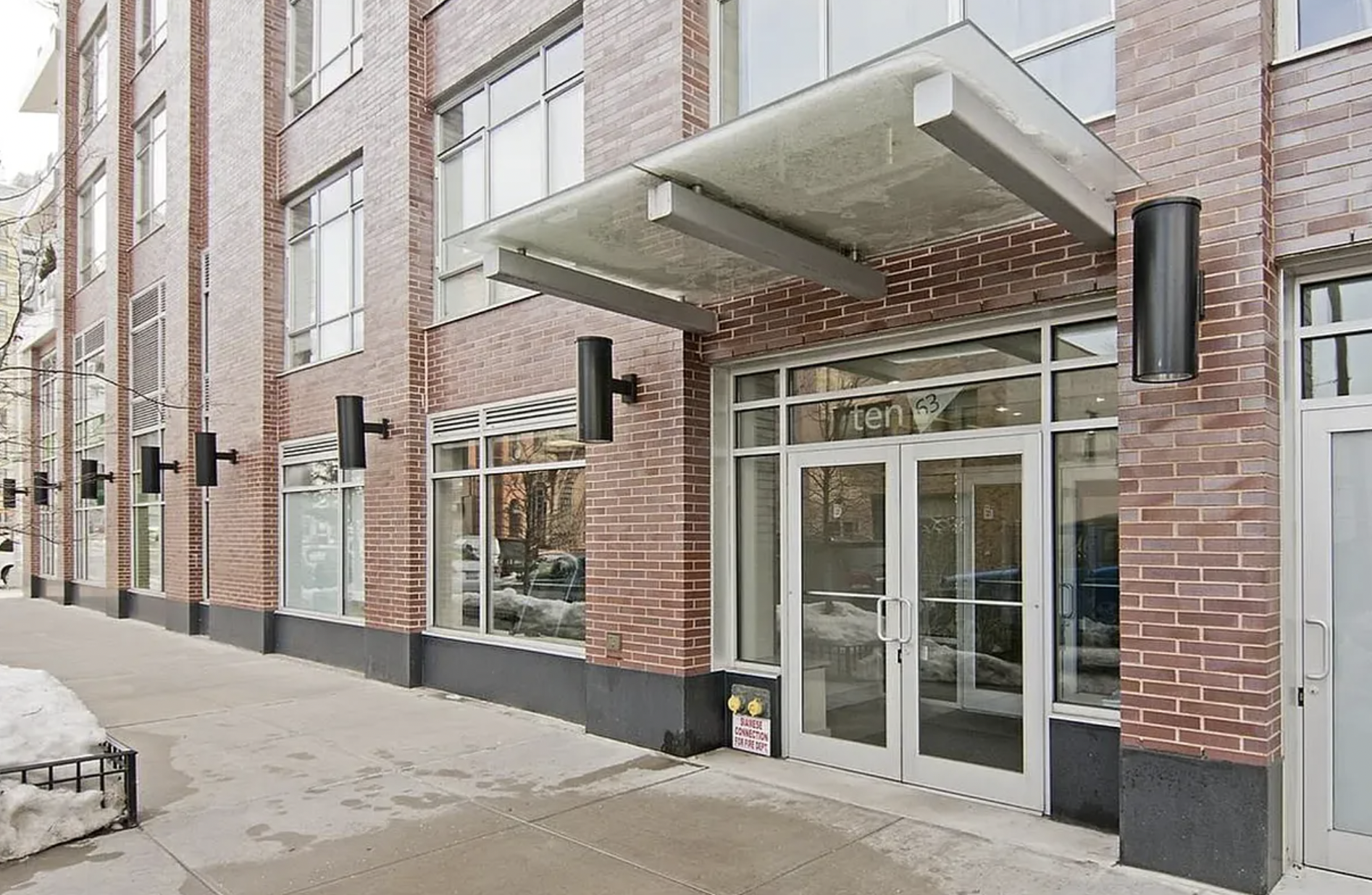 10-63 Jackson Avenue, Unit 7A Queens, NY 11101 - Photo 10 of 11 a view of a brick building with a entrance