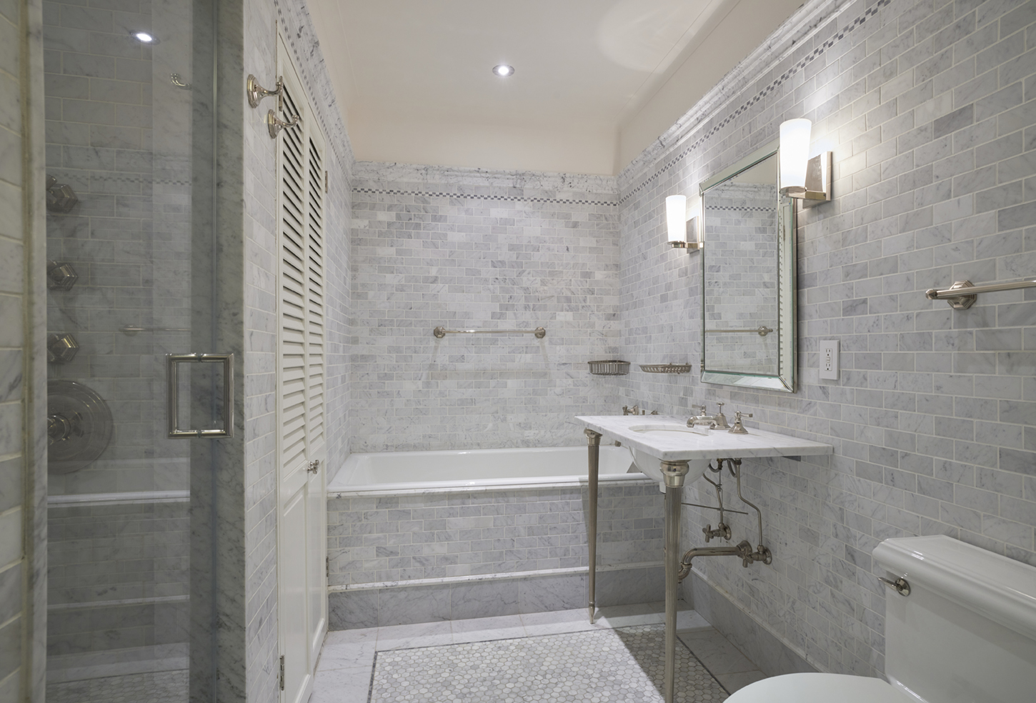 115 Central Park West, Unit 18JK Manhattan, NY 10023 - Photo 15 of 25 a bathroom with a sink a toilet and shower