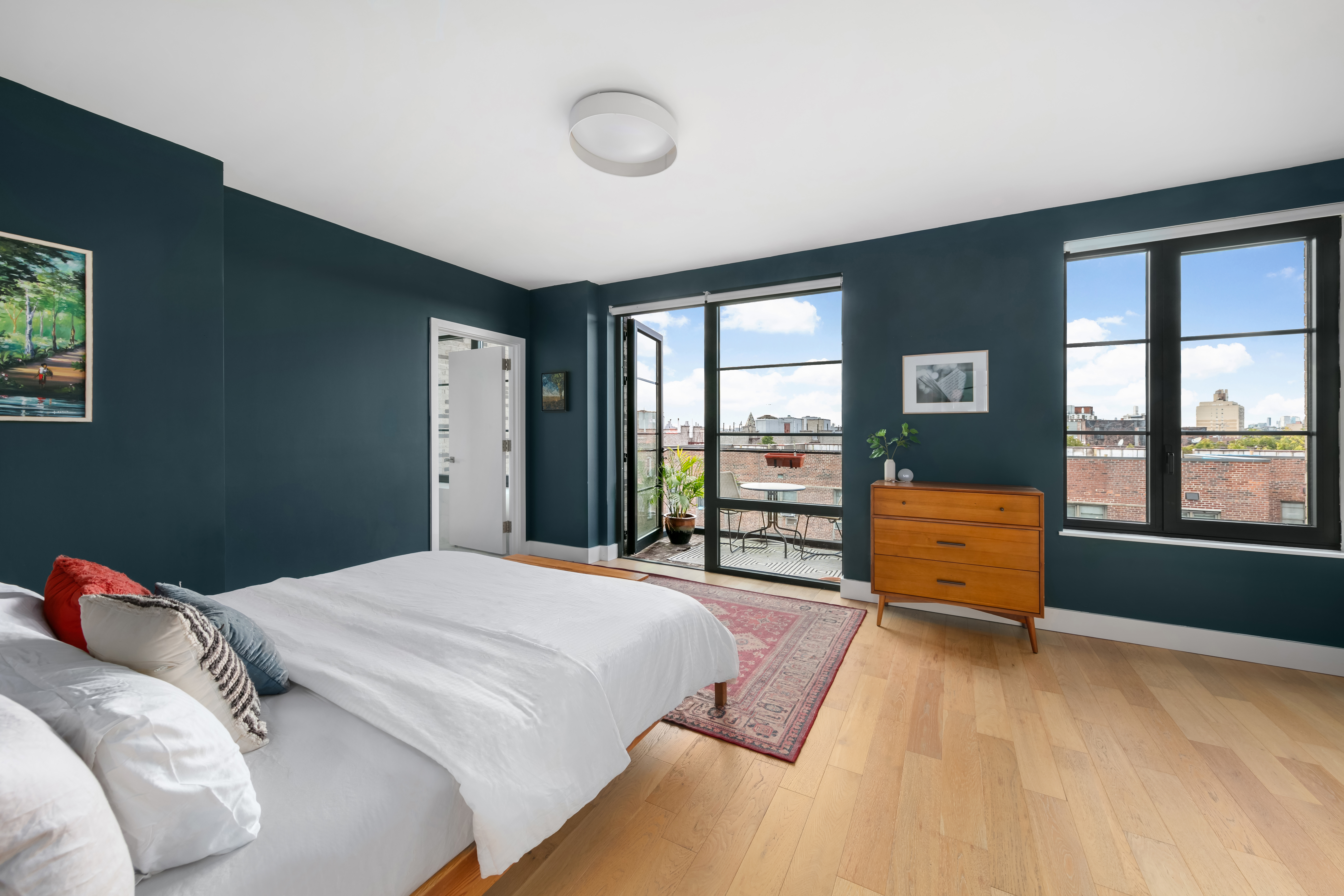 264 Webster Avenue, Unit PH811 Brooklyn, NY 11230 - Photo 5 of 14 a bedroom with a bed and a large window