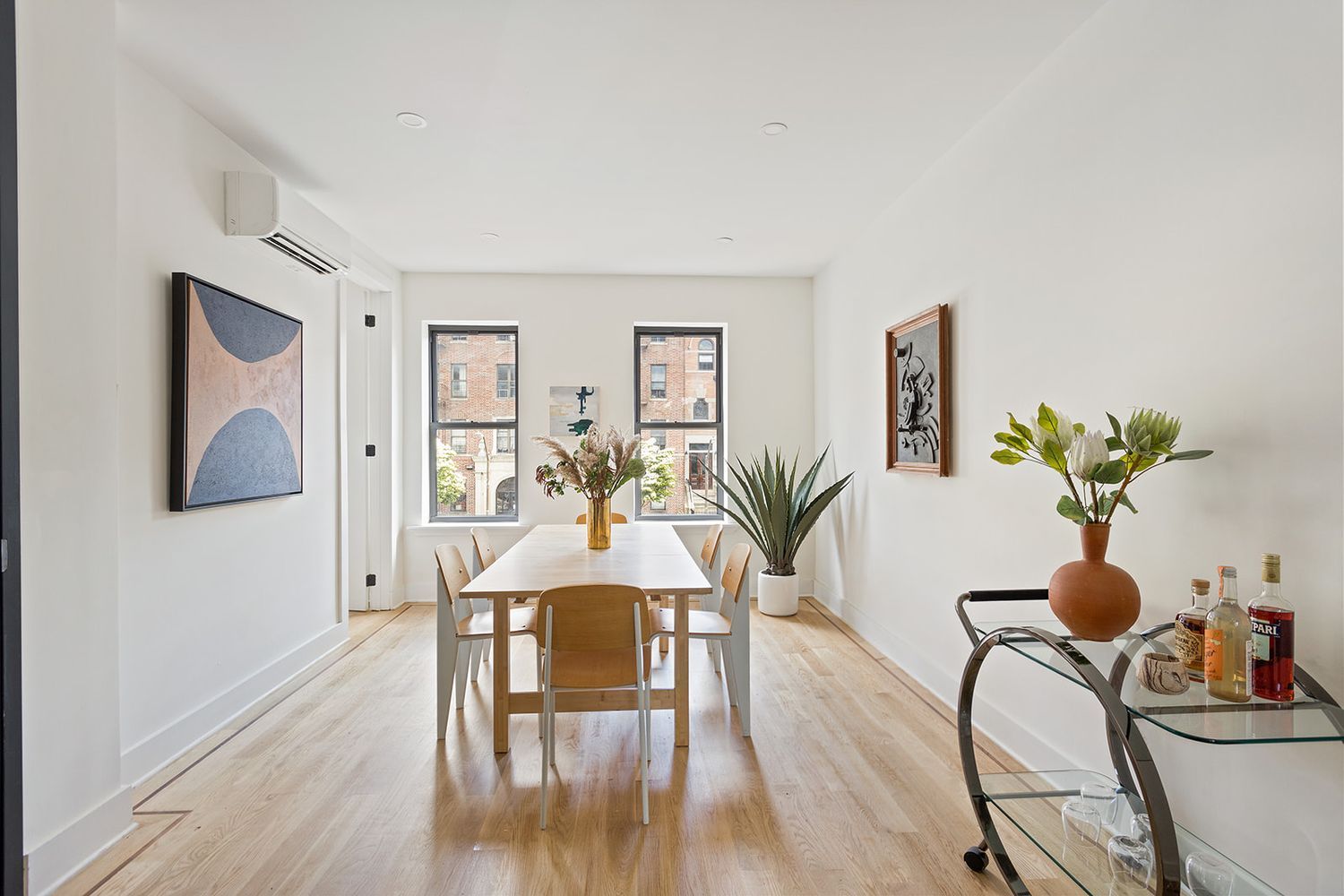 917 Saint Marks Avenue, Unit 3 Brooklyn, NY 11213 - Photo 3 of 12 a view of a dining room with furniture and wooden floor