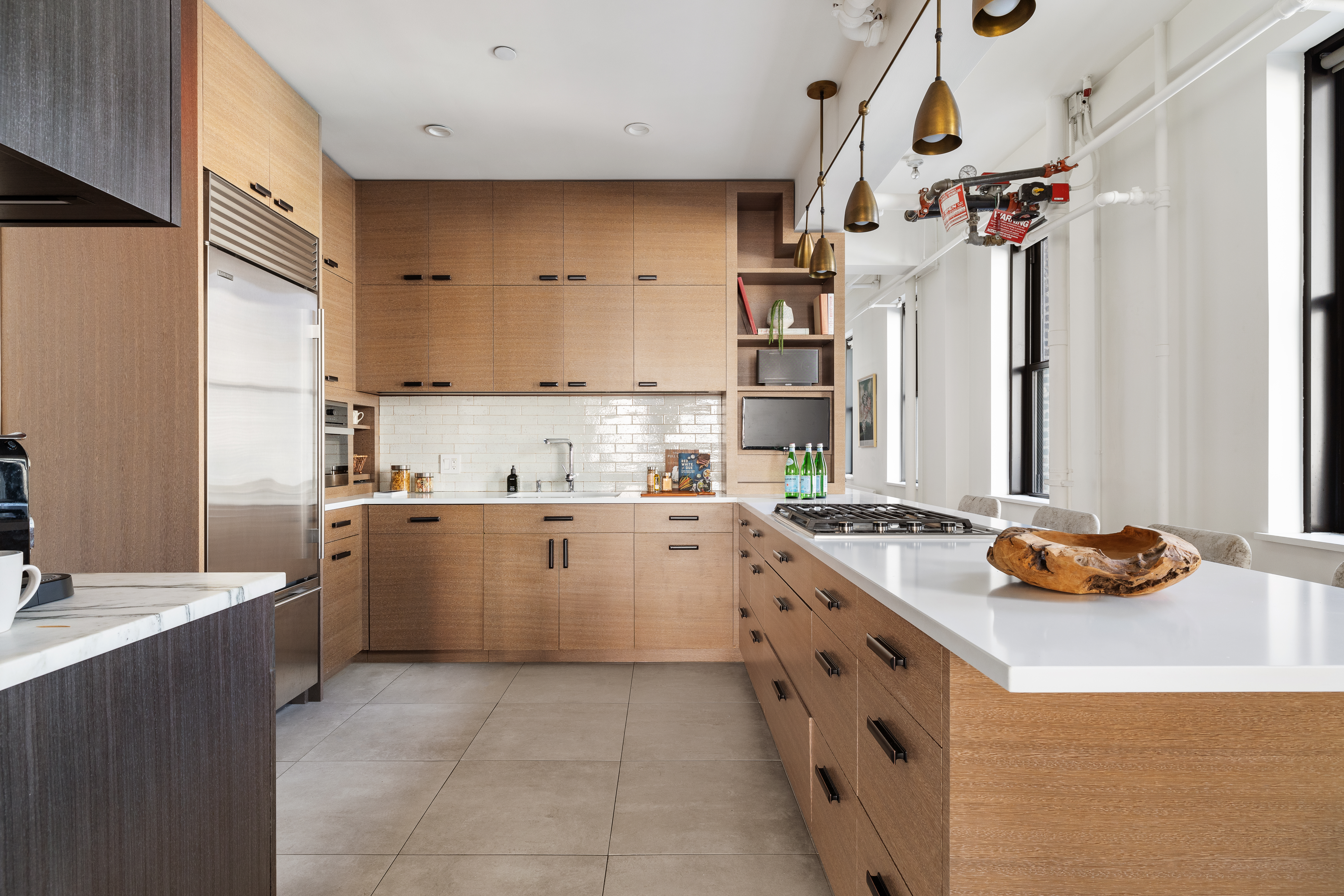 24 West 30th Street, Unit 6 Manhattan, NY 10001 - Photo 5 of 14 a kitchen with a sink stove and cabinets