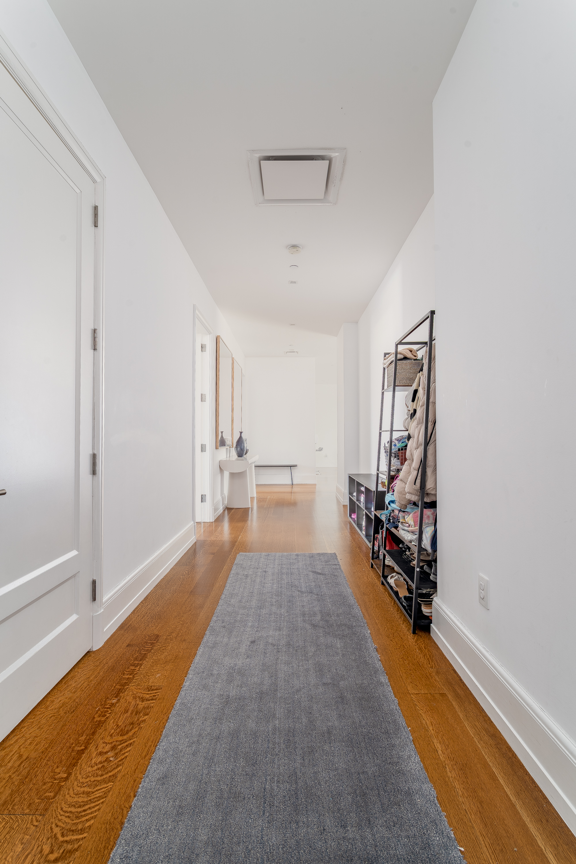 10 Madison Square West, Unit 16F Manhattan, NY 10010 - Photo 9 of 15 a view of a room with gym equipment and large windows