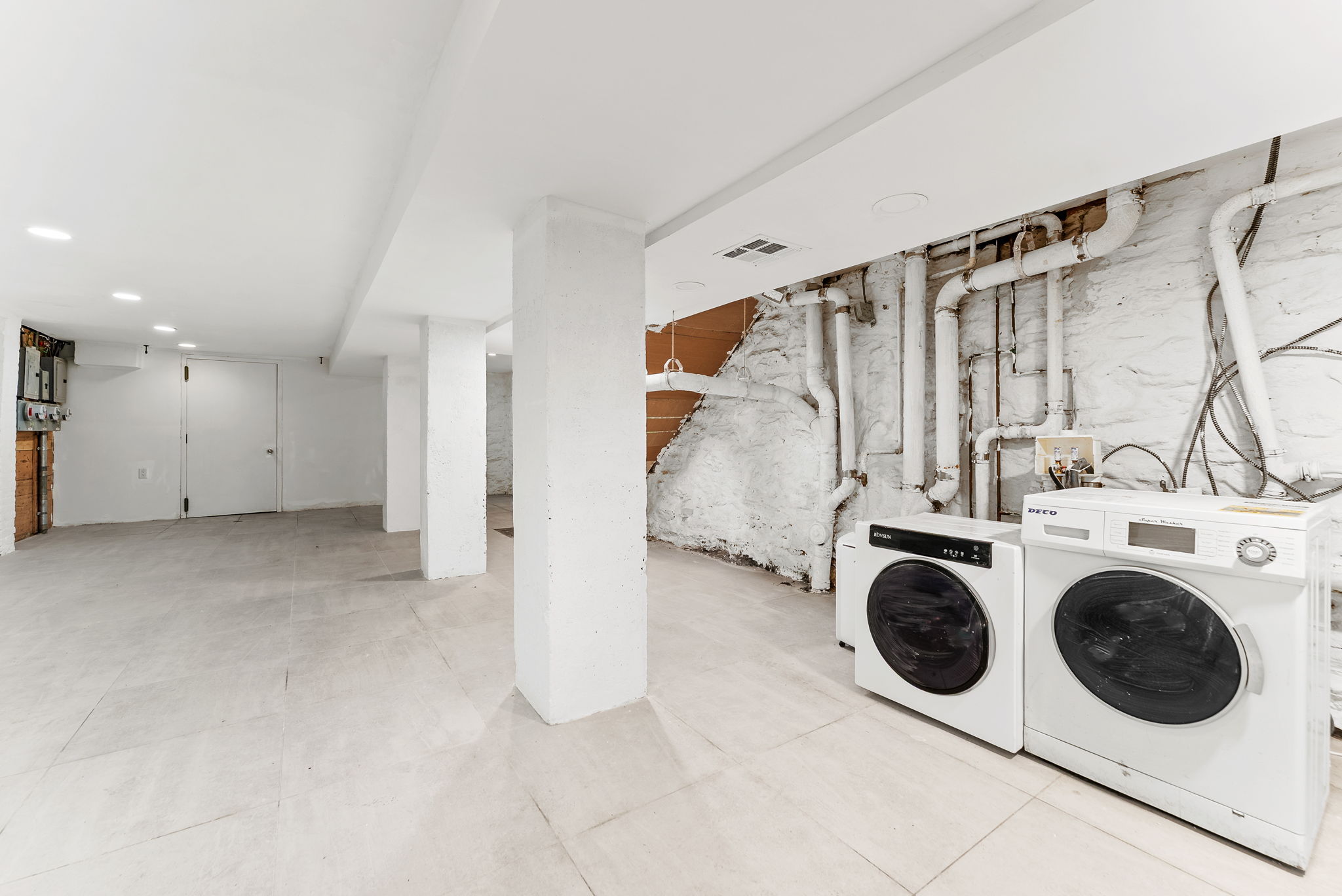 692 10th Street, Unit 1 Brooklyn, NY 11215 - Photo 10 of 12 a view of a storage & utility room with washer and dryer