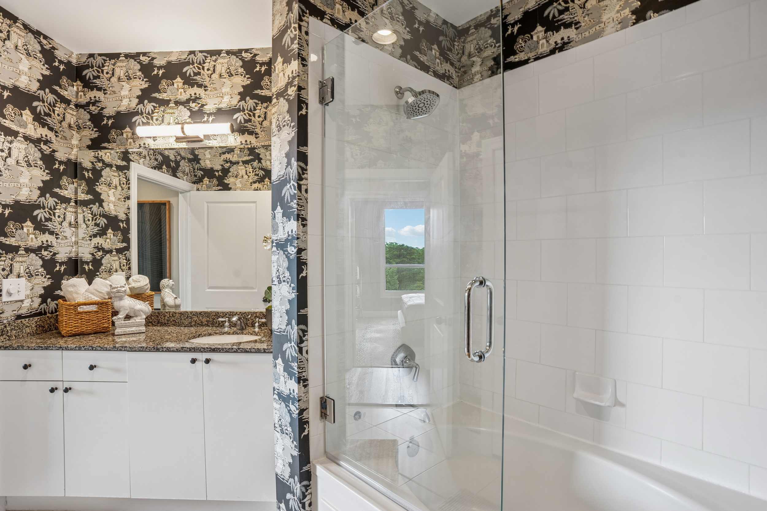 2626 Peachtree Road, Unit 1108 Atlanta, GA 30305 - Photo 14 of 25 a bathroom with a shower and a sink