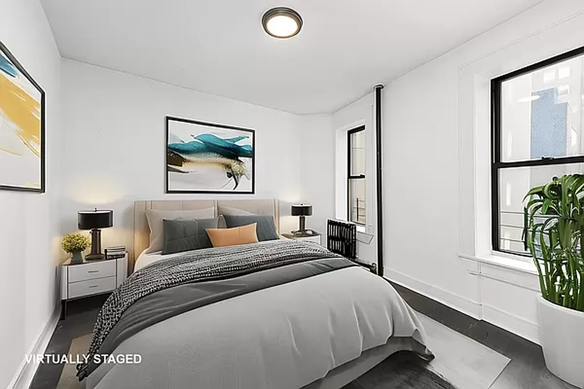 1392 Madison Avenue, Unit 15 Manhattan, NY 10128 - Photo 3 of 5 a bedroom with a bed and a window
