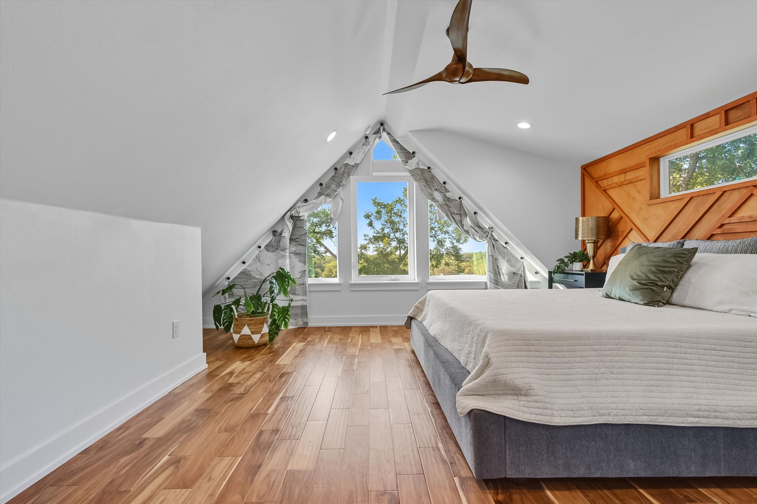 2712 Oak Springs Drive, Unit A Austin, TX 78702 - Photo 8 of 26 a bed sitting in a bedroom next to a window