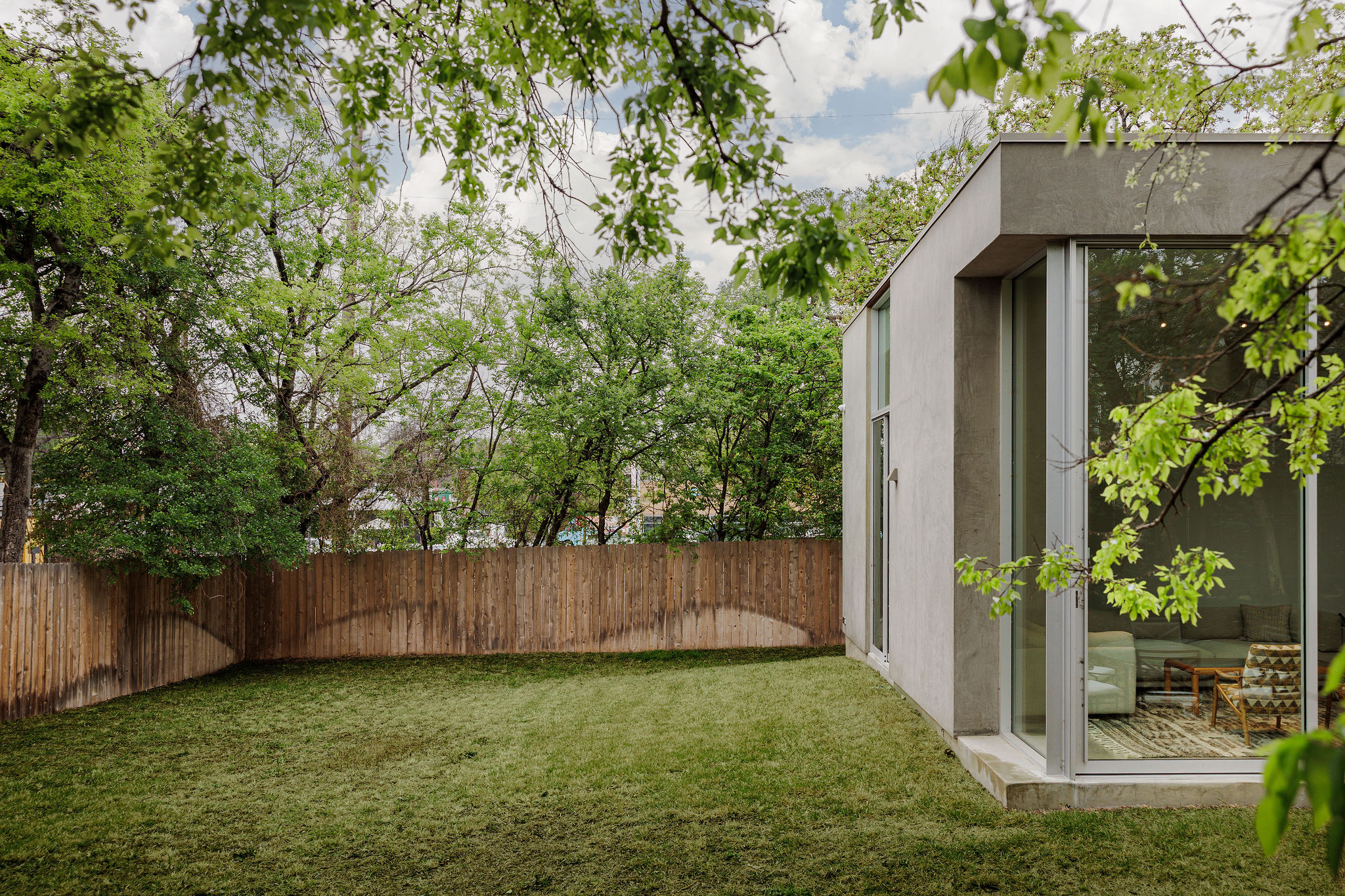 606 West 35th Street Austin, TX 78705 - Photo 35 of 37 a view of a backyard with plants and wooden fence