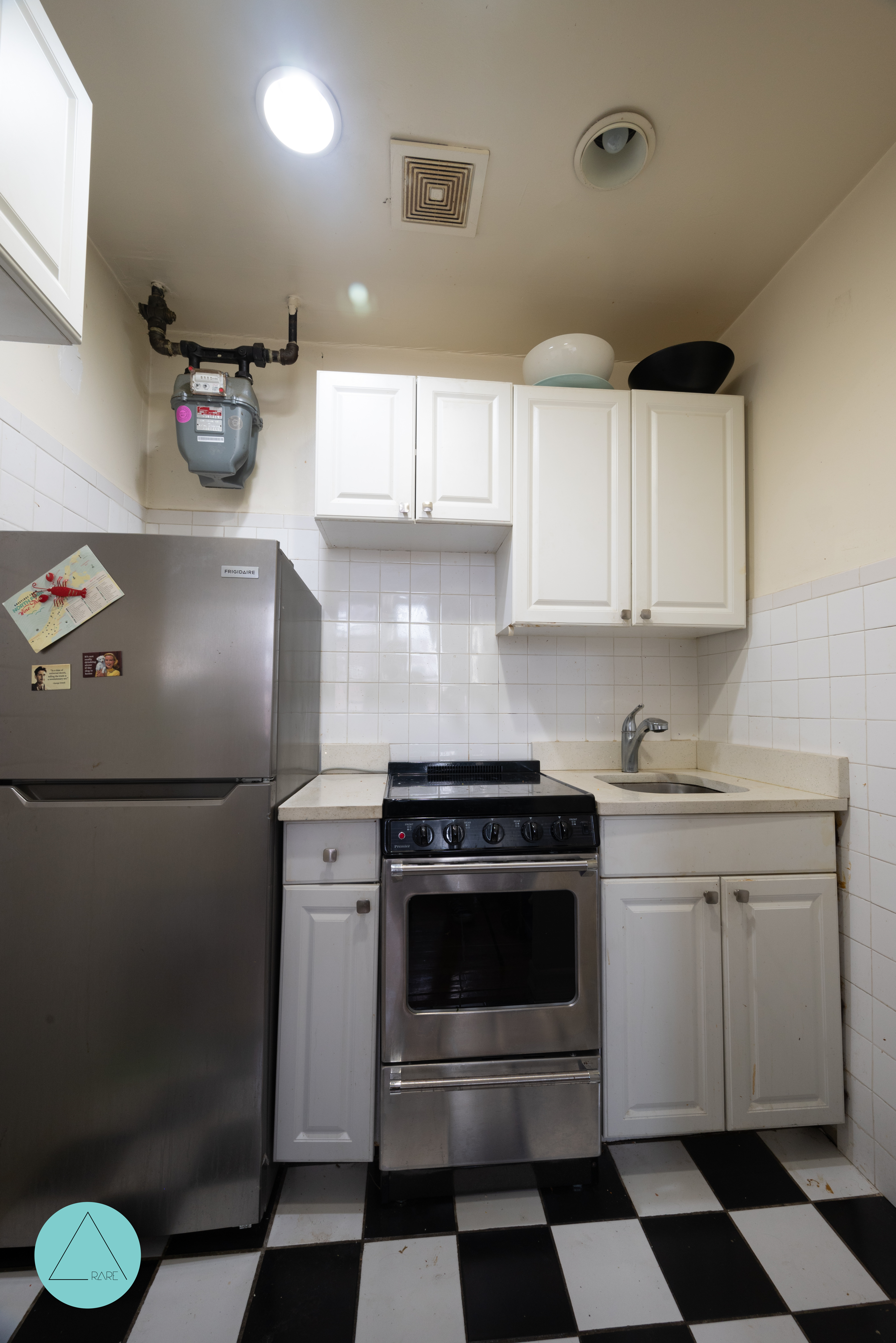 862 West End Avenue, Unit 4R Manhattan, NY 10025 - Photo 6 of 6 a kitchen with a stove sink and cabinets