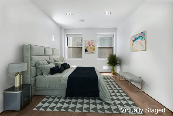 a bedroom with a bed and a view of bathroom