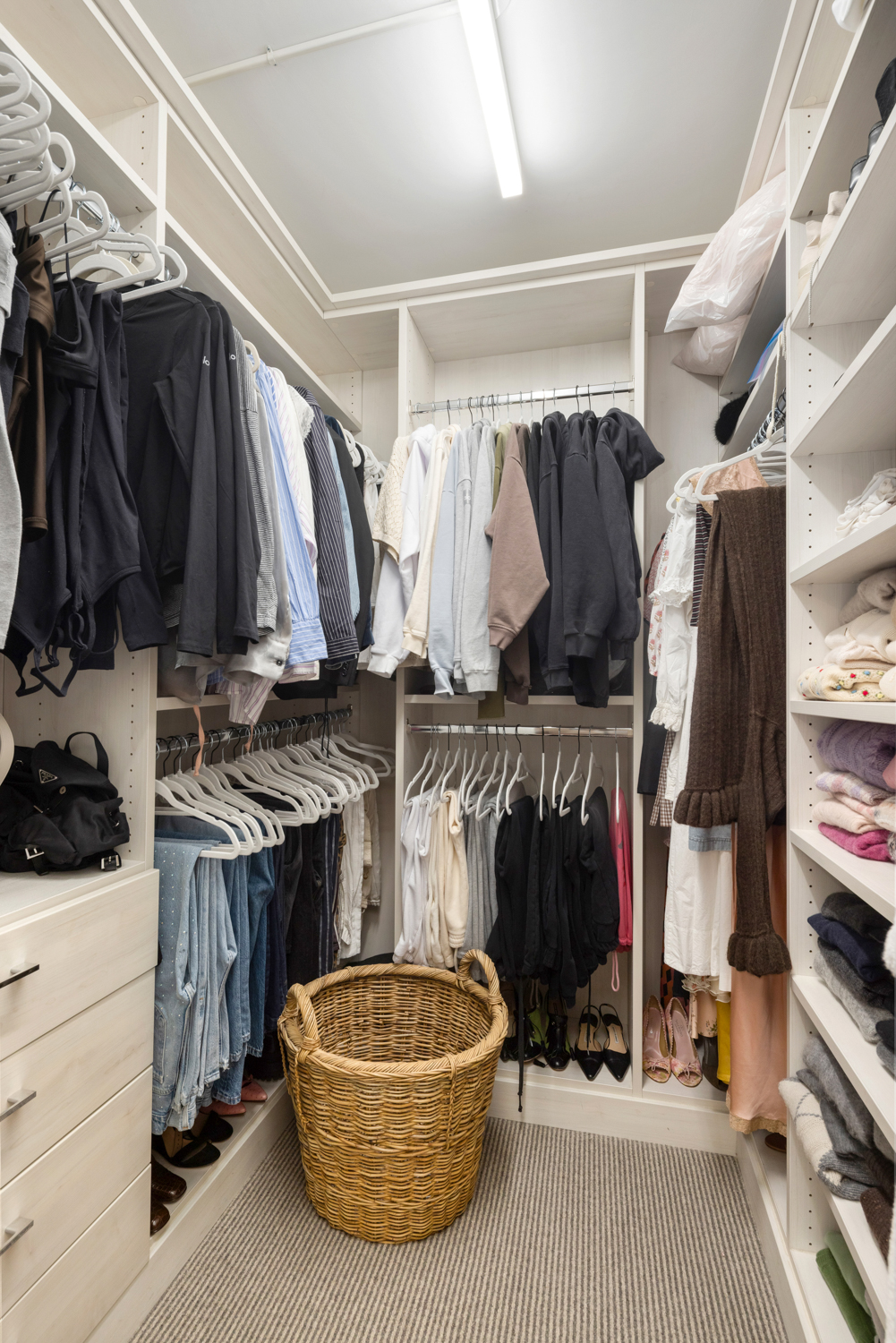 45 Christopher Street, Unit 2E Manhattan, NY 10014 - Photo 10 of 15 a view of walk in closet with clothes and shoes