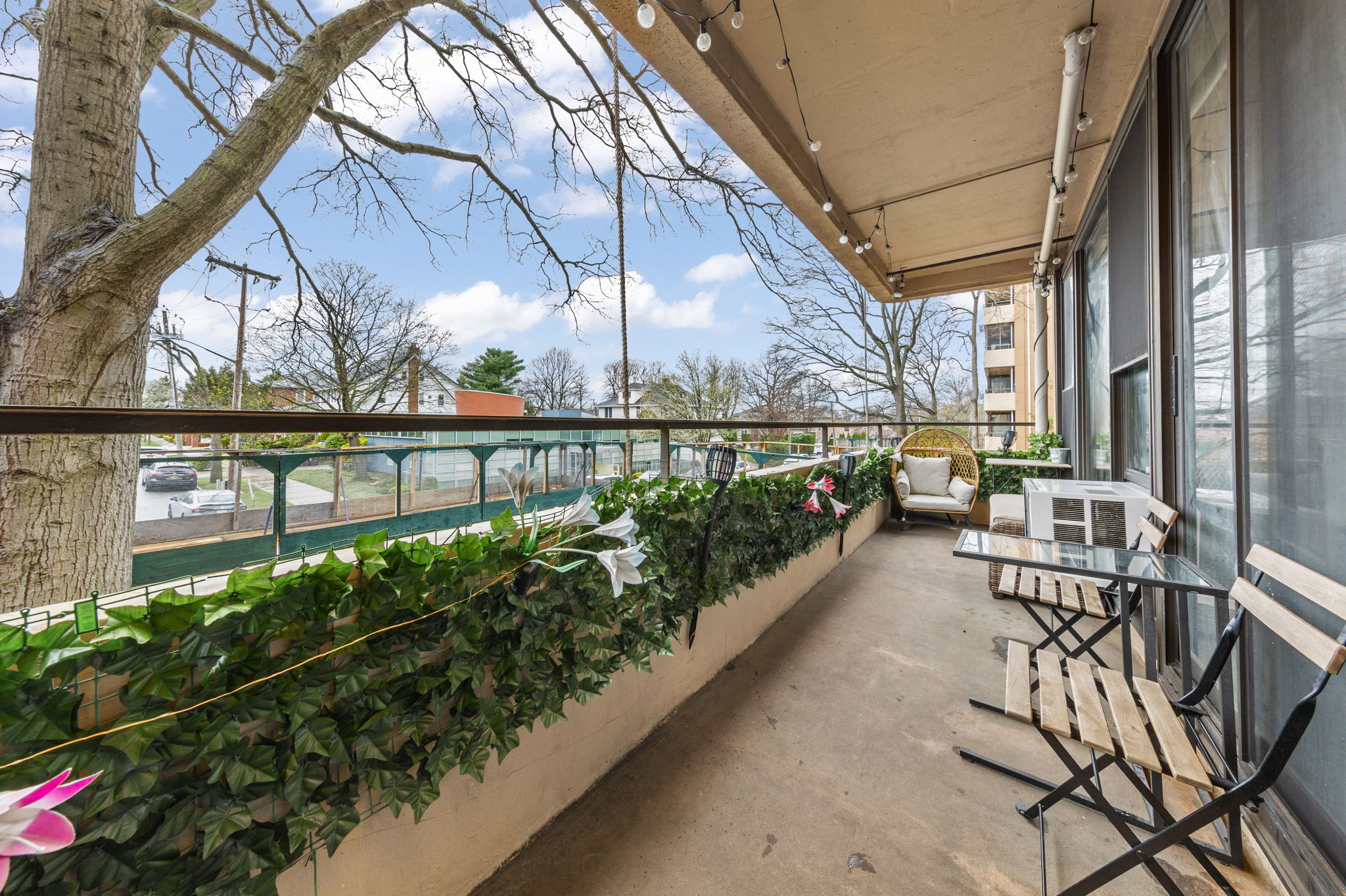 11-01 162nd Street, Unit 3D Queens, NY 11357 - Photo 11 of 16 a view of a chairs and table in the balcony
