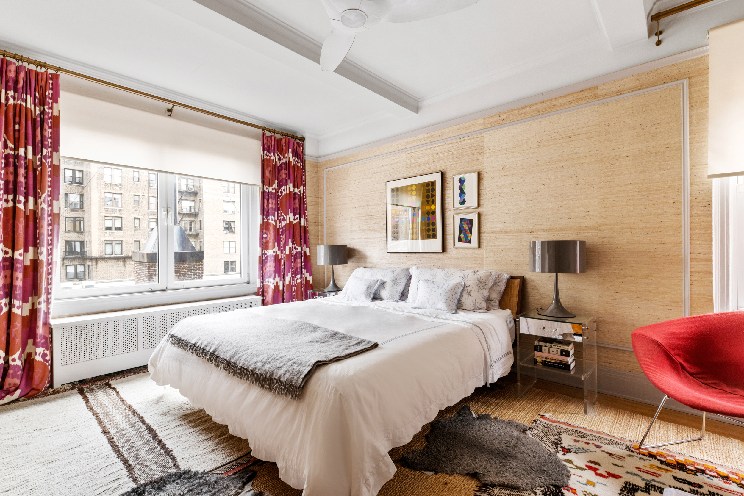 38 East 85th Street, Unit 10E Manhattan, NY 10028 - Photo 6 of 14 a bedroom with a bed and wooden floor