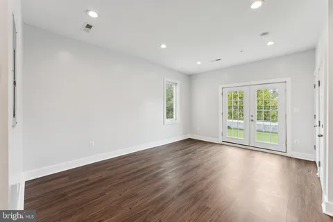 a house that has a tree in front of the house
