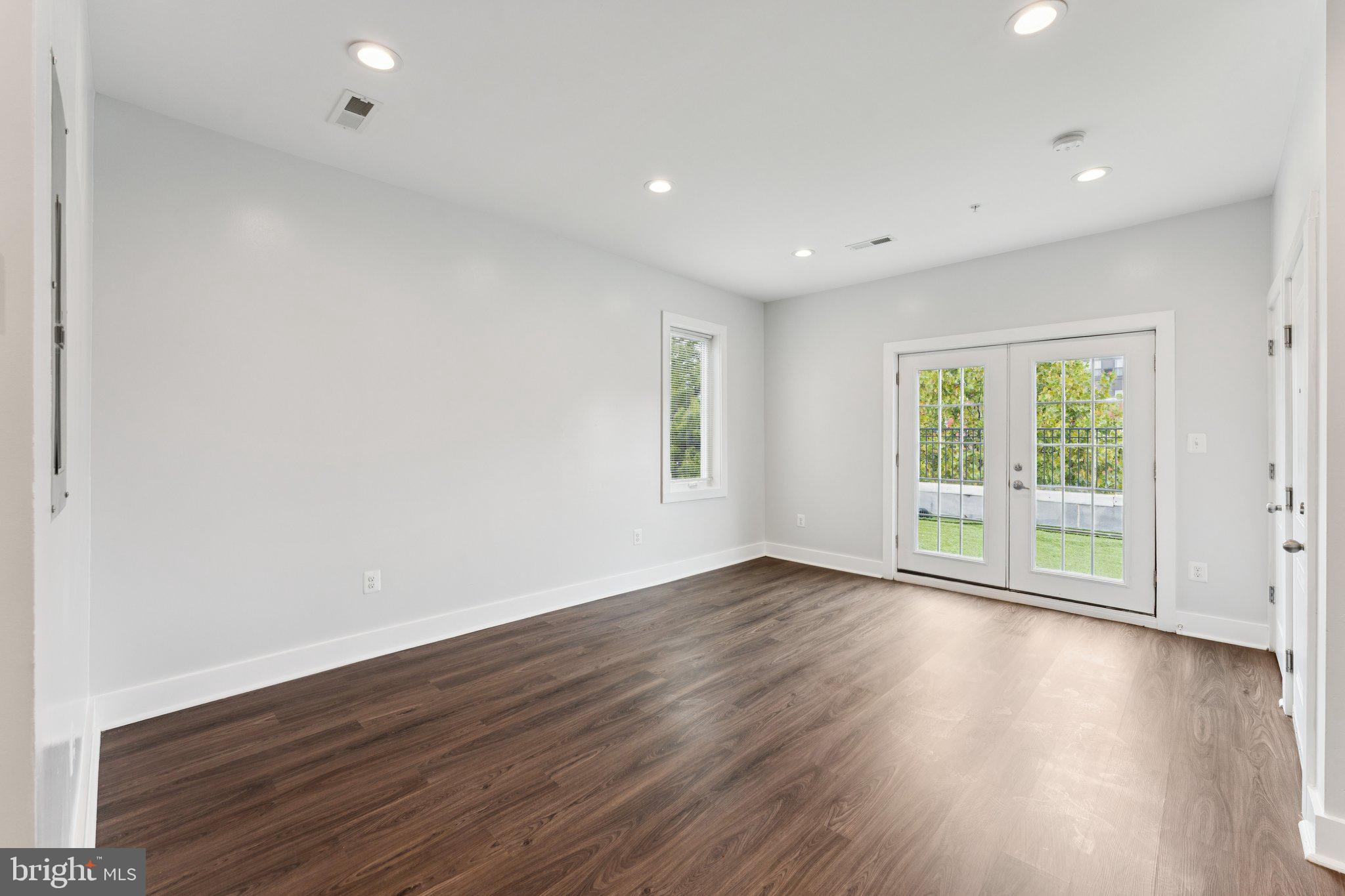 2822 28th Street Southeast Washington, DC 20020 - Photo 41 of 57 a view of an empty room with wooden floor and a window