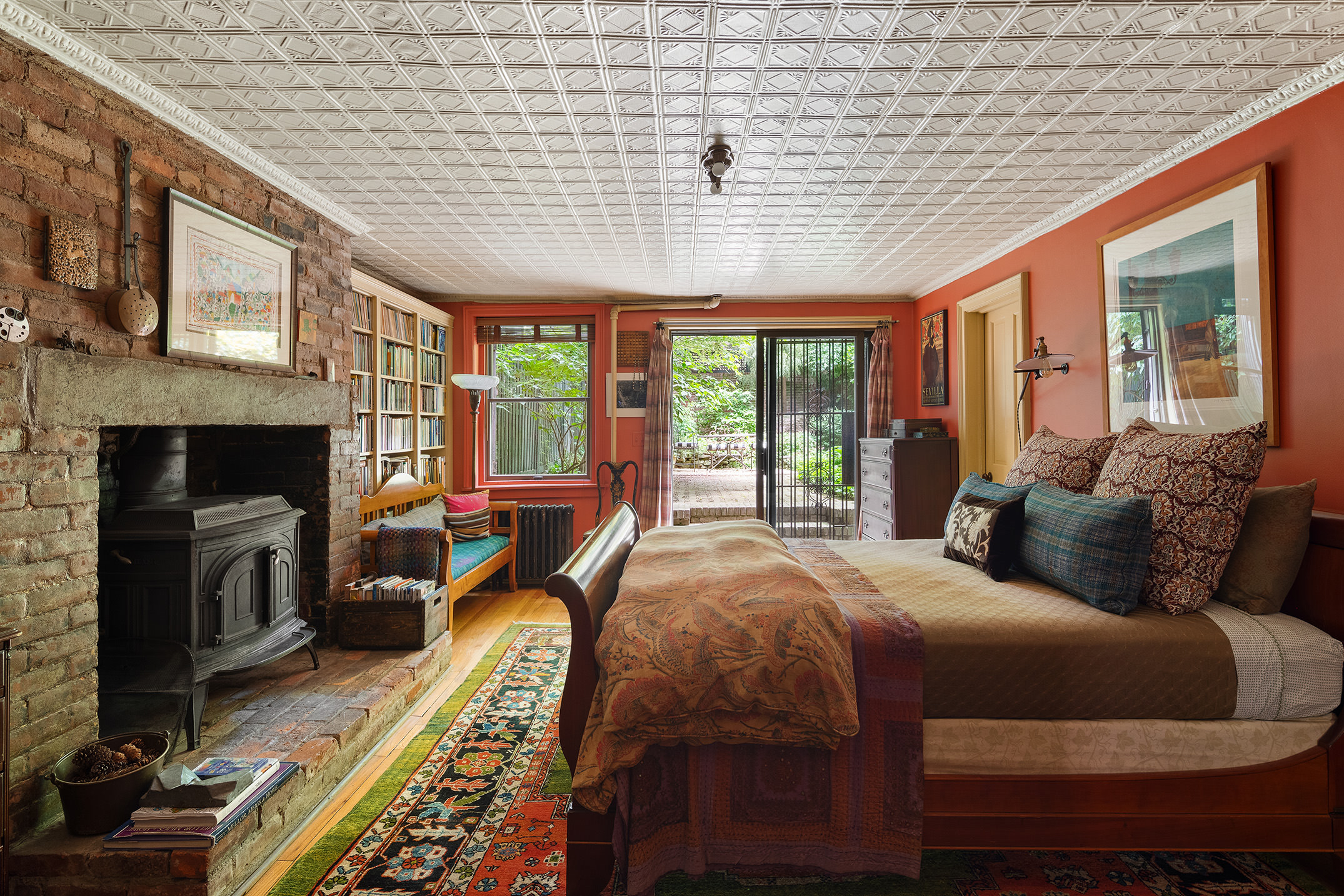 433 Pacific Street Brooklyn, NY 11217 - Photo 13 of 22 a bed room with a bed and a fireplace