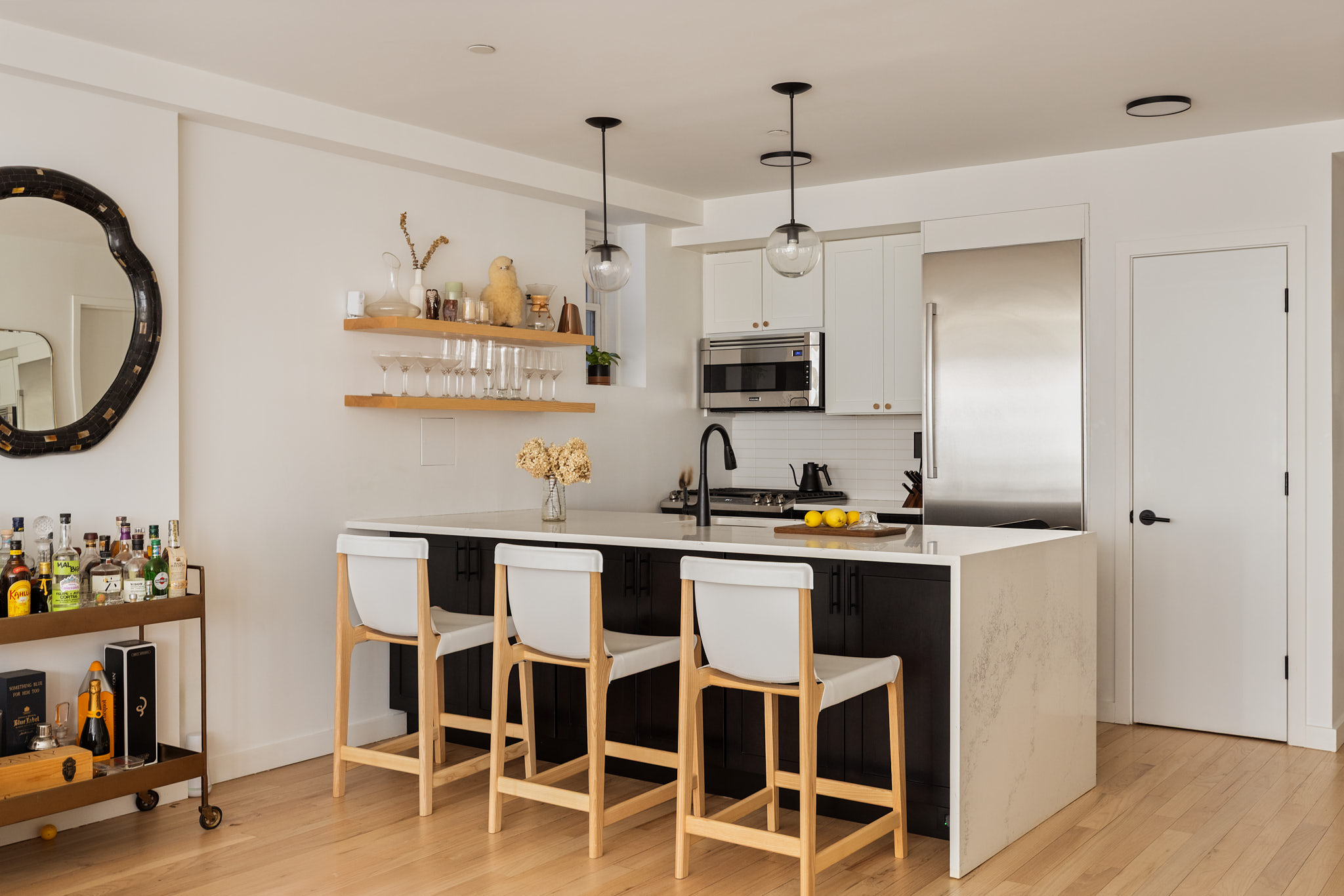 182 Mulberry Street, Unit 4 Manhattan, NY 10012 - Photo 7 of 13 a kitchen with cabinets a sink and appliances