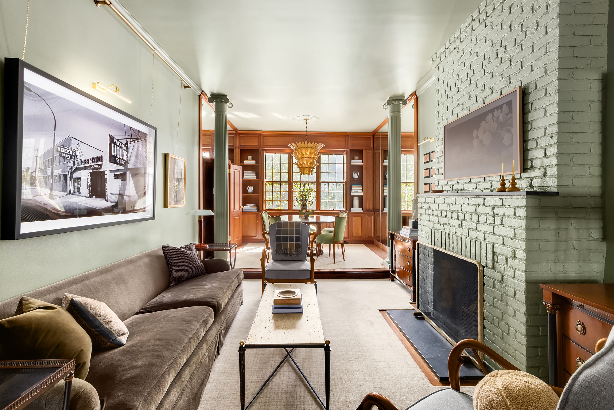 159 West 13th Street Manhattan, NY 10011 - Photo 21 of 36 a living room with furniture a fireplace and a flat screen tv