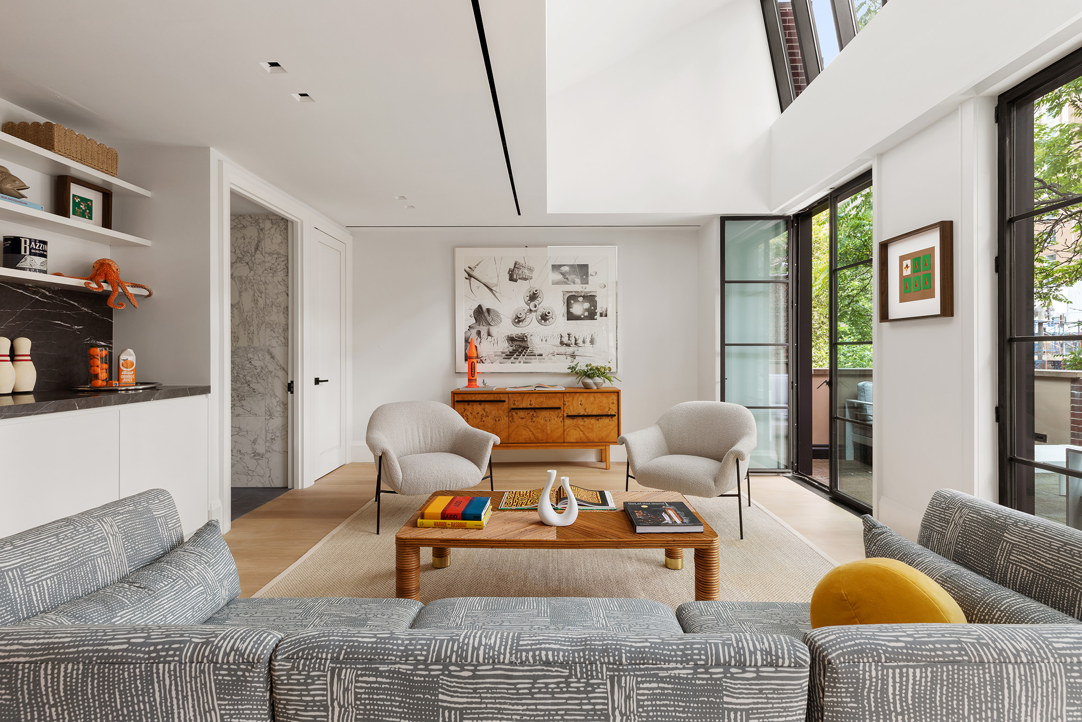 17 East 9th Street Manhattan, NY 10003 - Photo 24 of 32 a living room with furniture and a couch