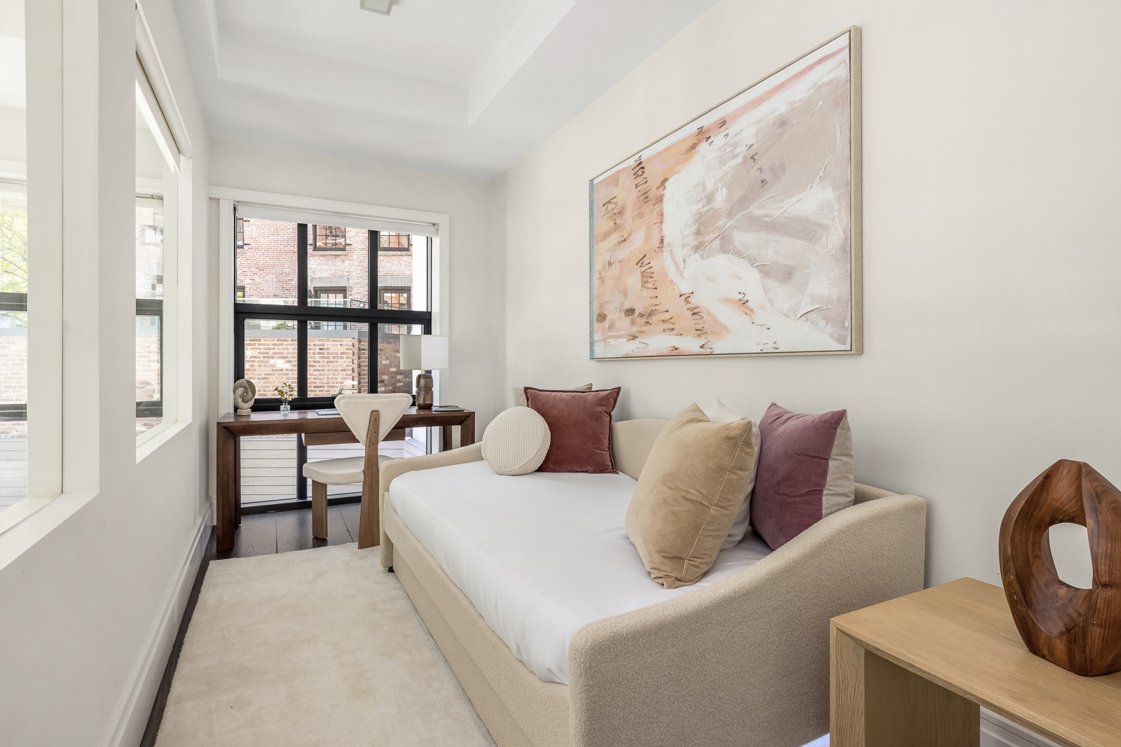 137 Franklin Street, Unit 1 Manhattan, NY 10013 - Photo 17 of 25 a living room with furniture and a painting on the wall