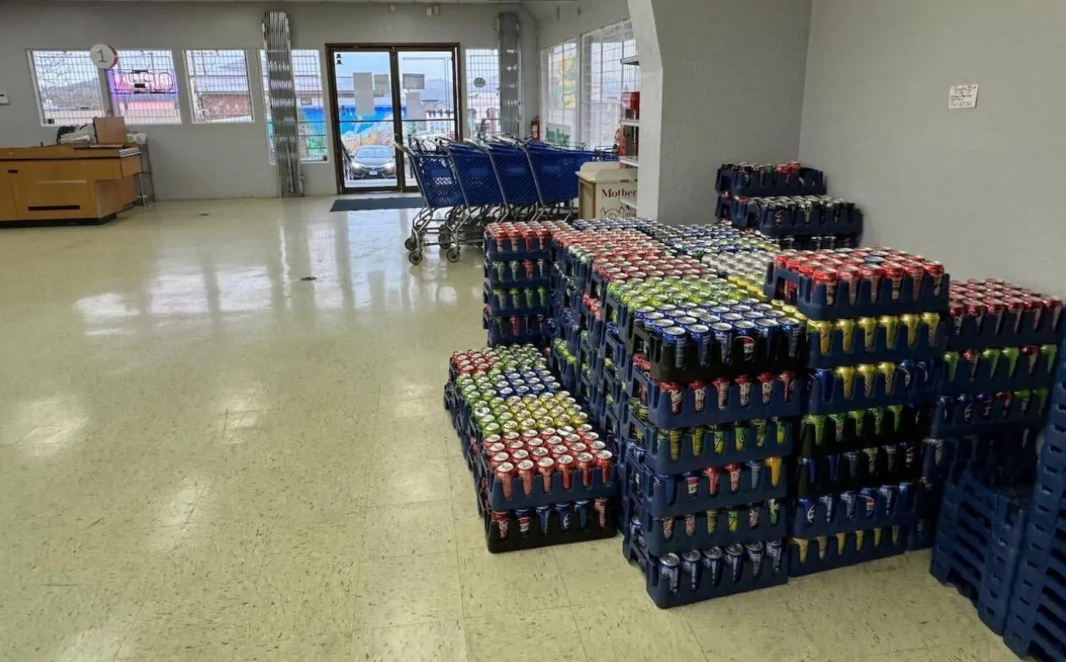 a bedroom with furniture and a large window