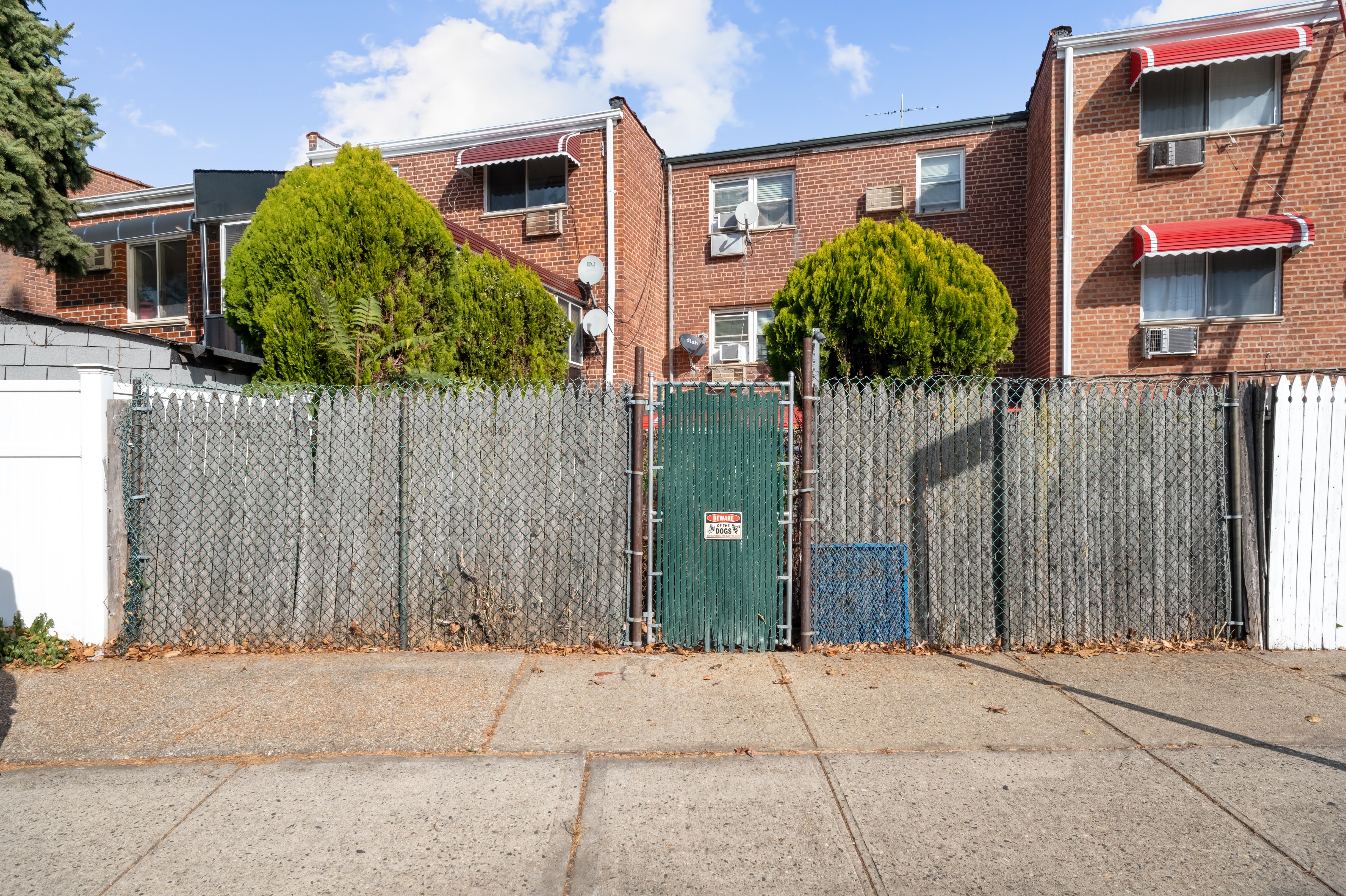 1464 East 84th Street Brooklyn, NY 11236 - Photo 14 of 22 a house with a tree in front of it