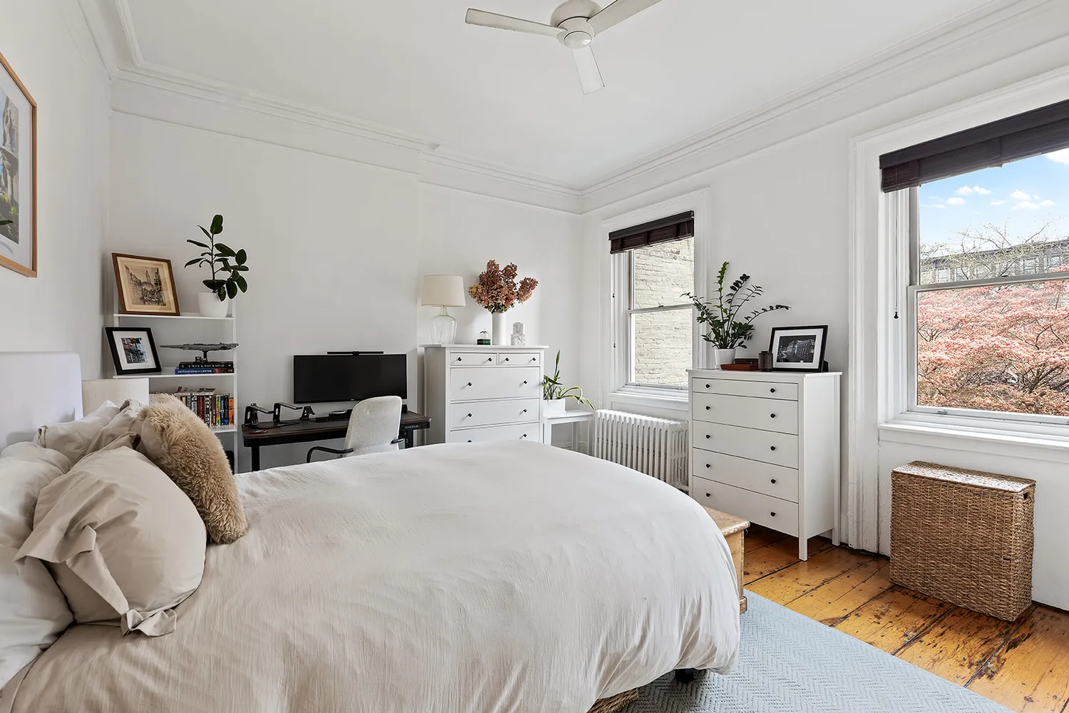 a bedroom with a bed and a dresser