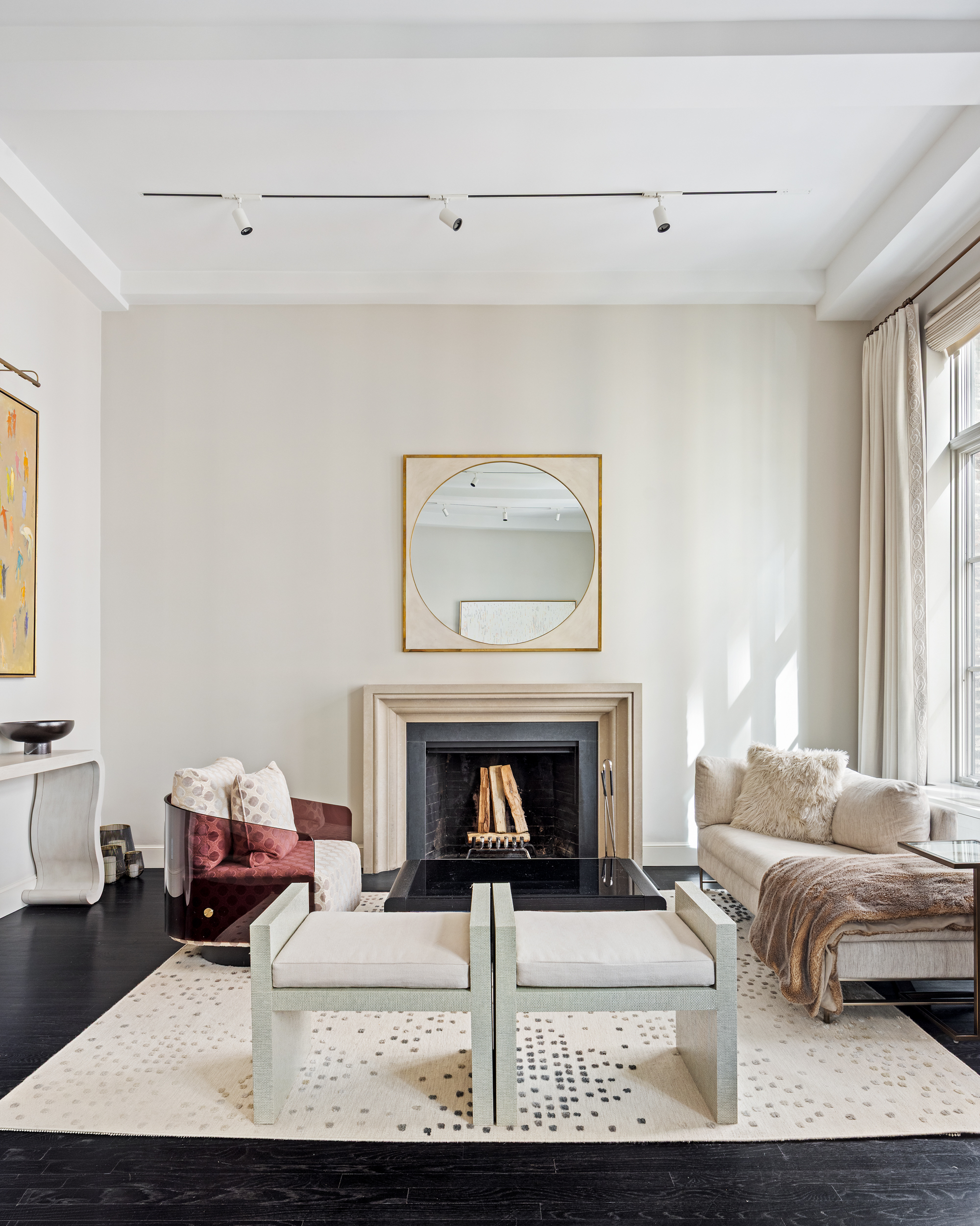 169 East 78th Street, Unit 7C Manhattan, NY 10075 - Photo 10 of 30 a living room with furniture and a fireplace