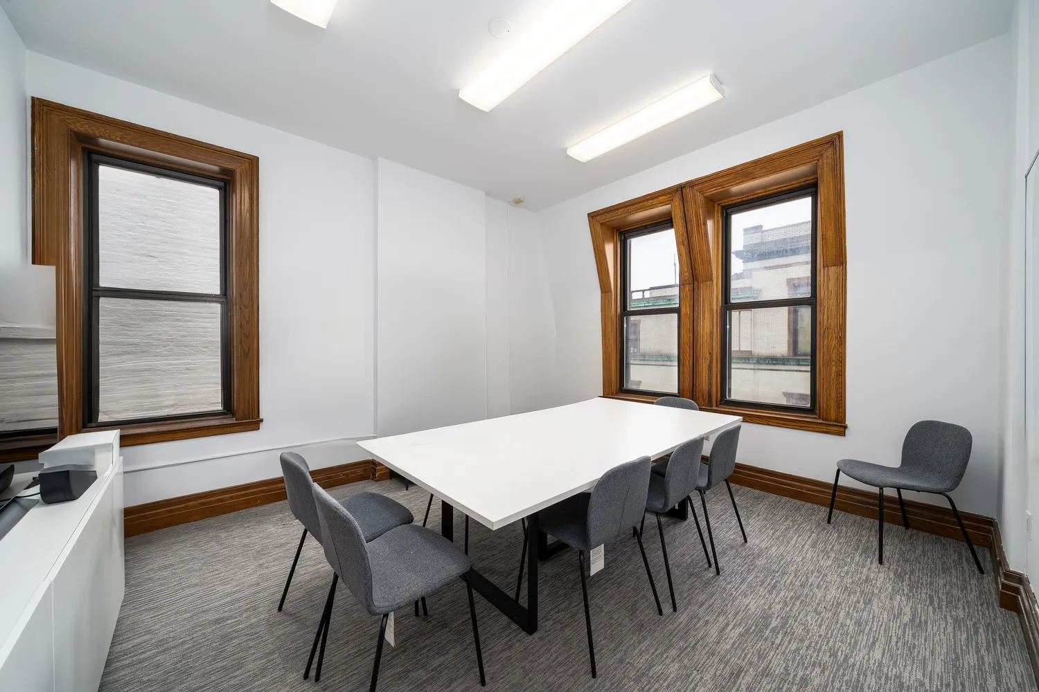a view of a dining room with furniture and window