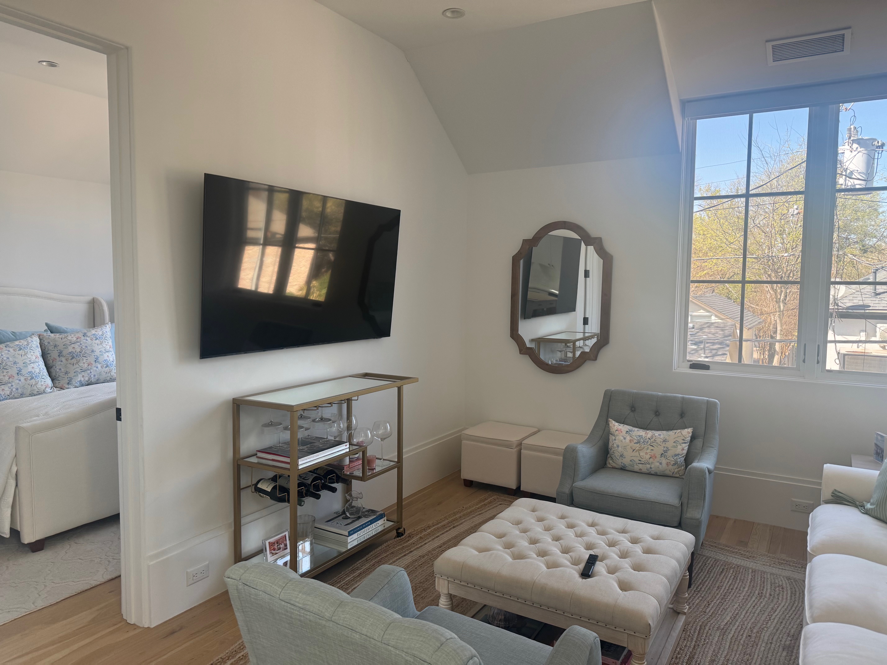 Address Upon Request Dallas, TX 75219 - Photo 3 of 12 a living room with furniture and a flat screen tv