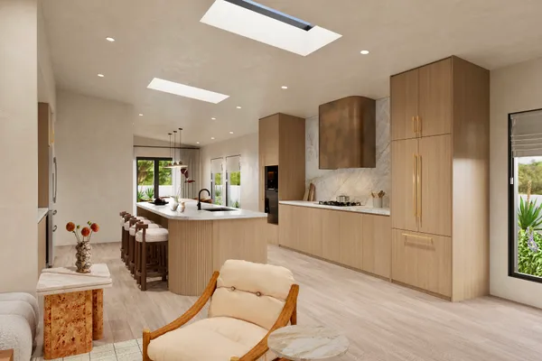 a kitchen with stainless steel appliances granite countertop a refrigerator and a stove top oven