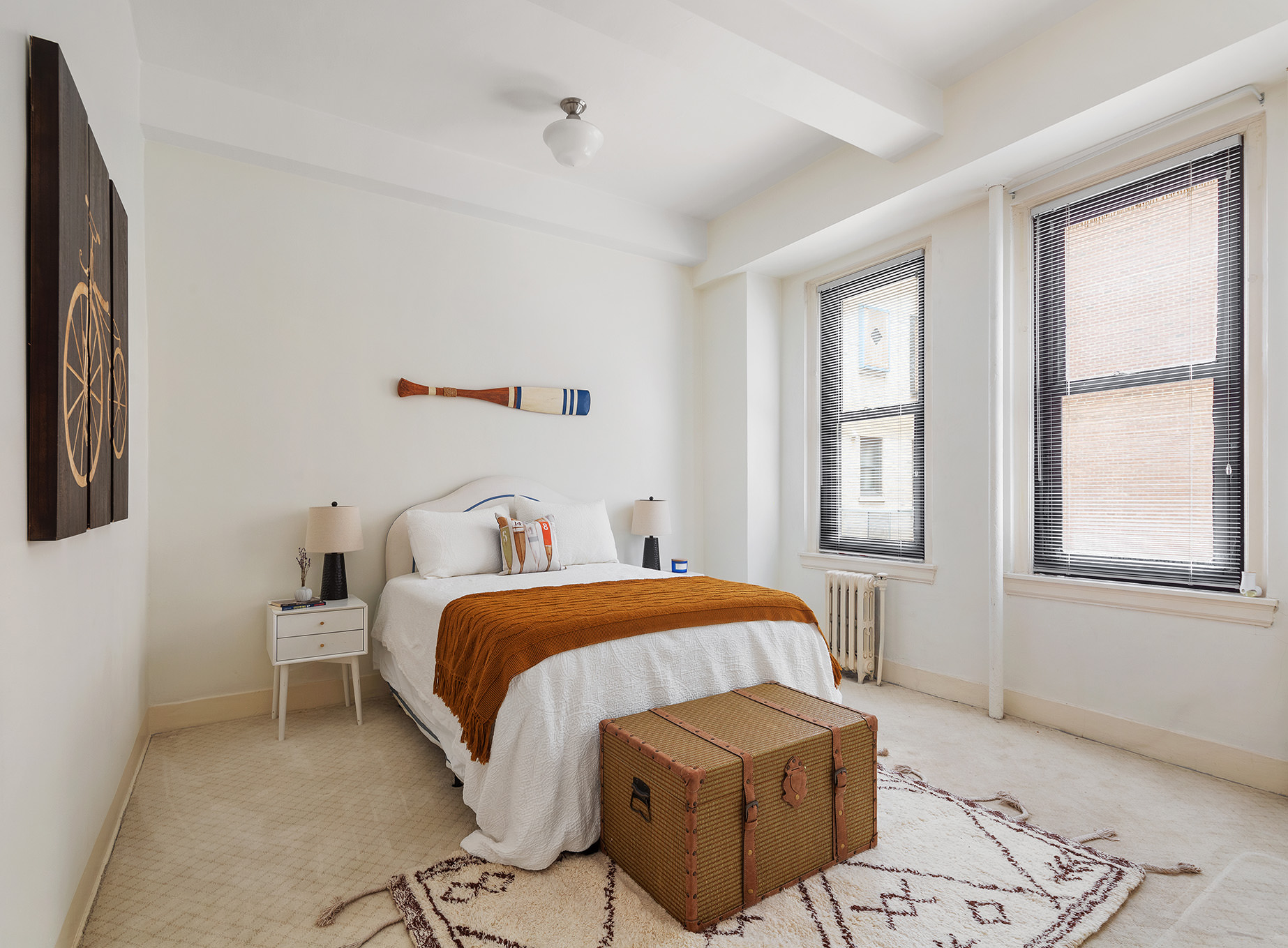 1115 5th Avenue, Unit 5B Manhattan, NY 10128 - Photo 9 of 19 a bedroom with a bed and a window