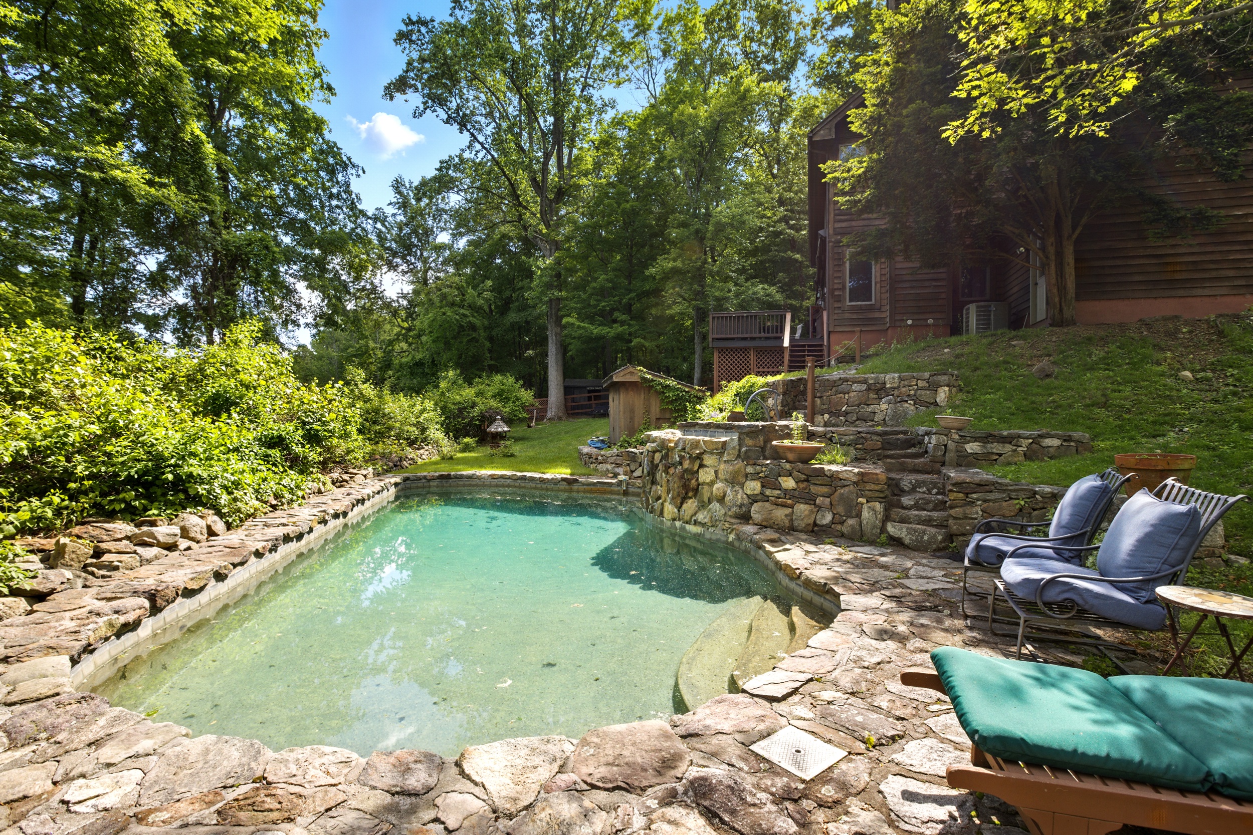 19 Pond Road Cold Spring, NY 10516 - Photo 23 of 32 a view of a swimming pool with a patio and a yard