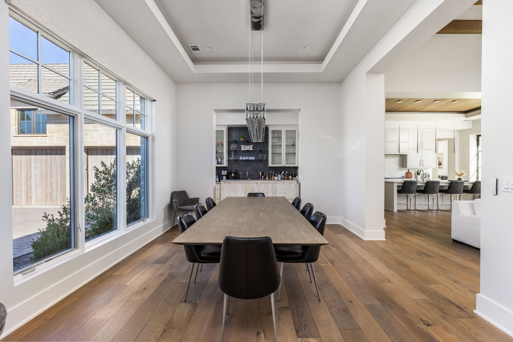 522 Delayne Drive Austin, TX 78737 - Photo 20 of 23 a view of a dining room with furniture wooden floor and chandelier