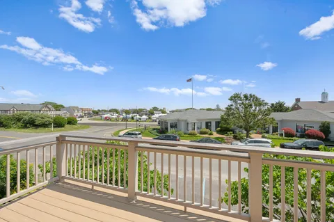 a view of balcony with furniture
