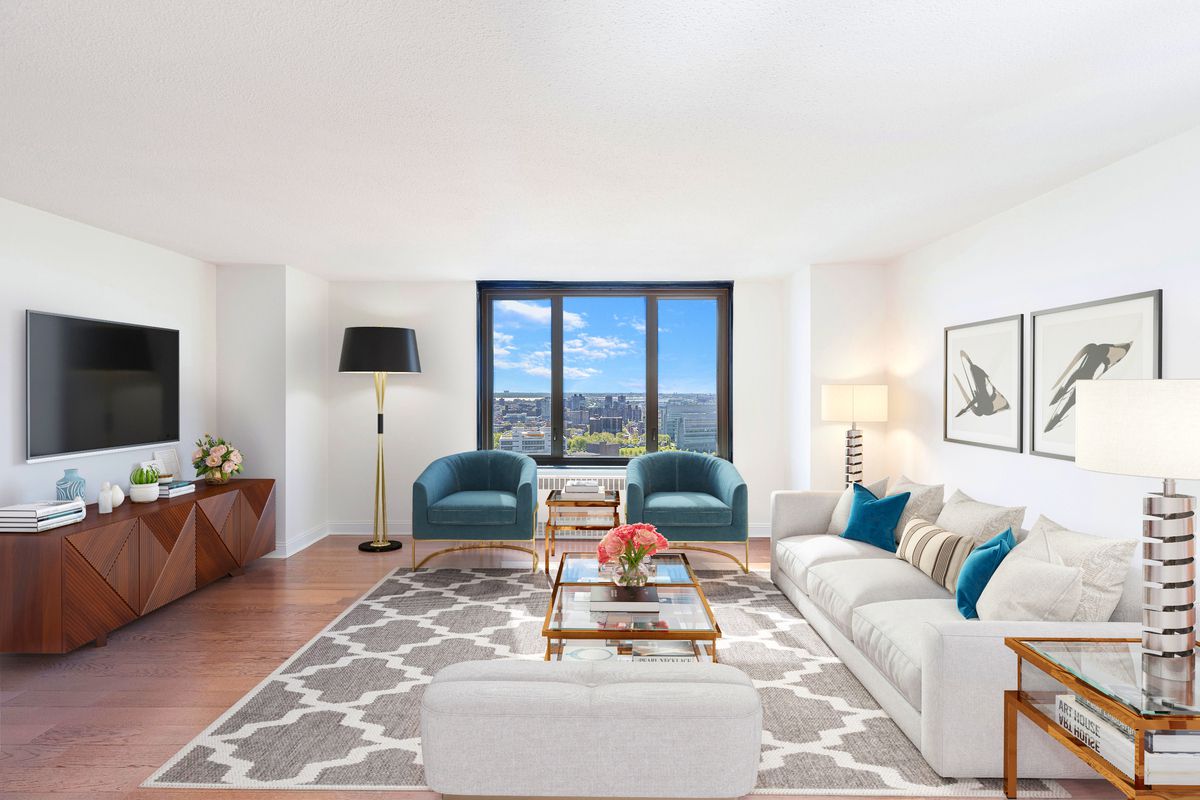 3333 Broadway, Unit D4G Manhattan, NY 10031 - Photo 2 of 21 a living room with furniture and a flat screen tv