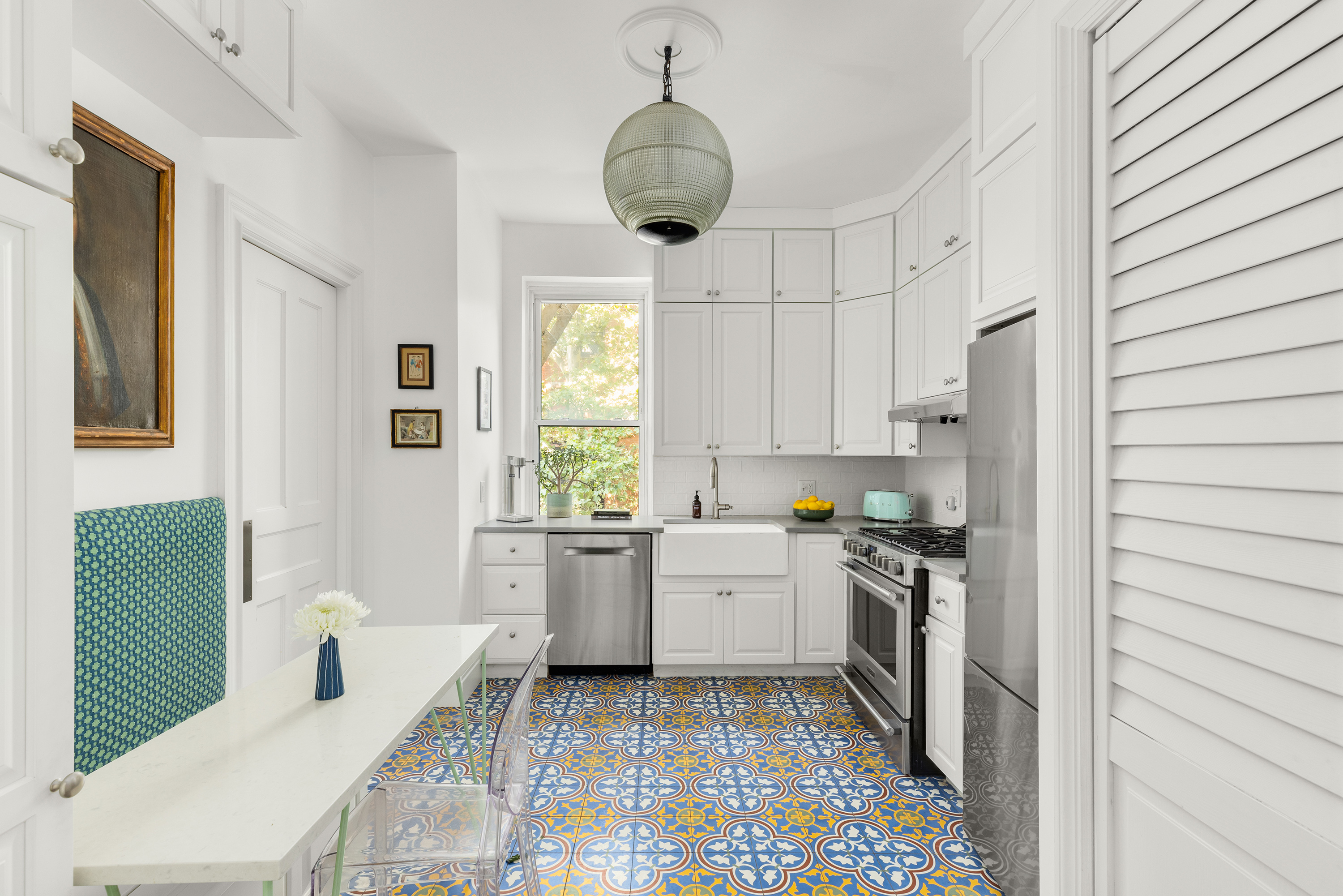 144 Garfield Place, Unit 2R Brooklyn, NY 11215 - Photo 4 of 12 a kitchen with stainless steel appliances a stove a sink and a refrigerator