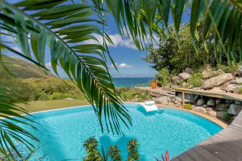 a view of swimming pool with seating area