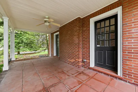 a kitchen with stainless steel appliances granite countertop a stove refrigerator sink and microwave