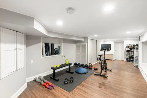 a view of a livingroom with furniture and a flat screen tv