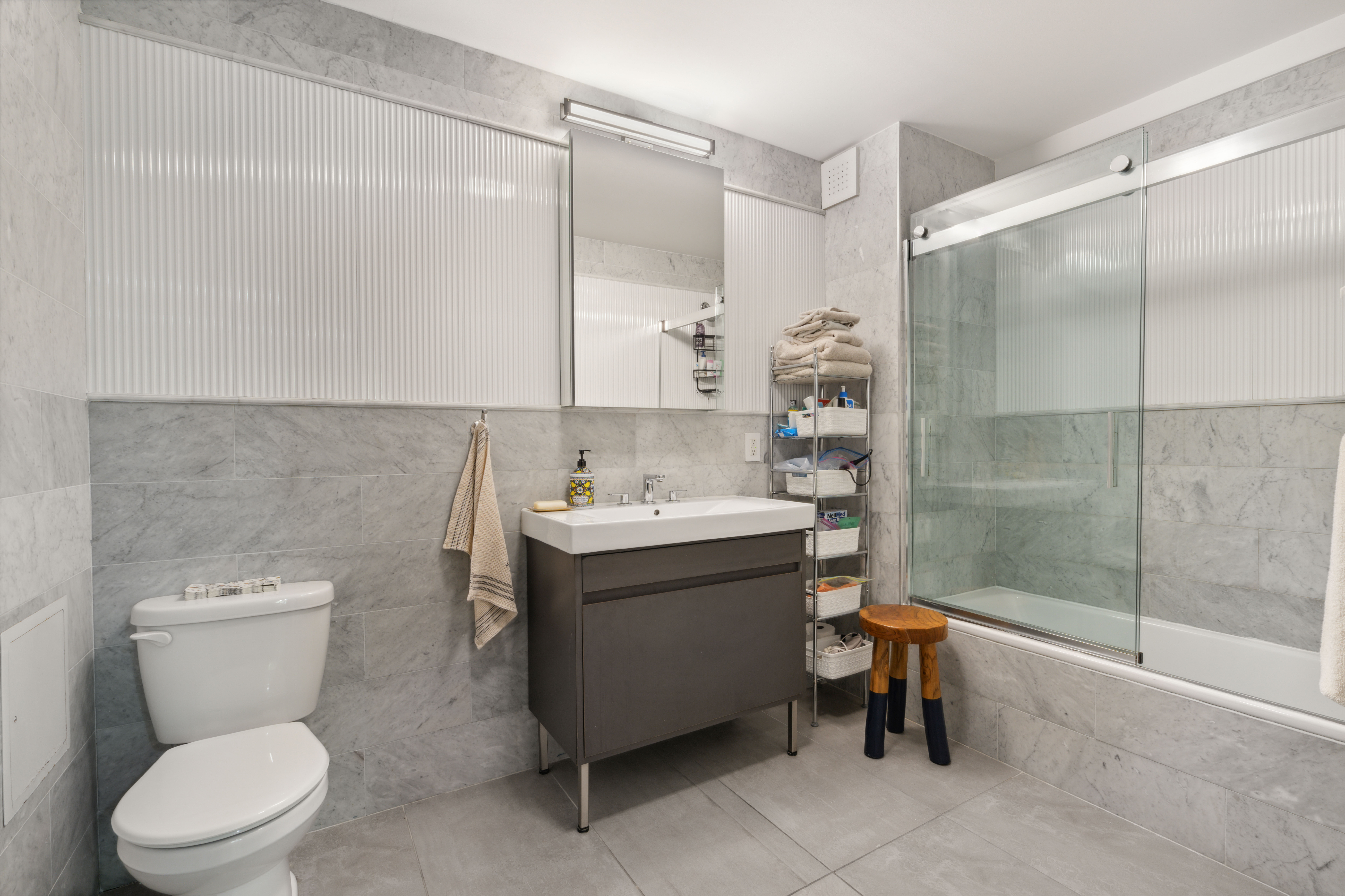 25 Monroe Place, Unit 1C Brooklyn, NY 11201 - Photo 3 of 14 a bathroom with a sink toilet and shower