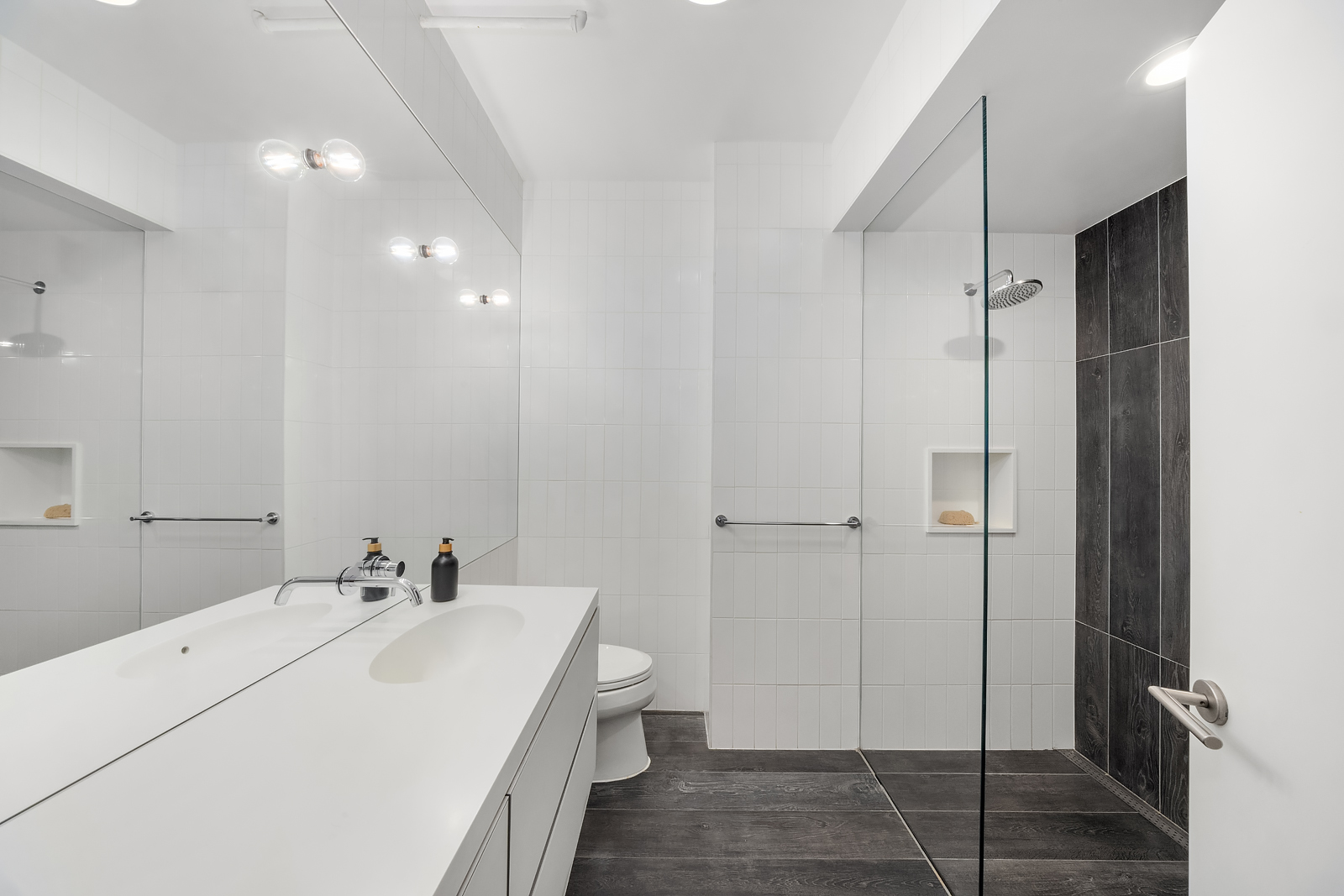 36 West 15th Street, Unit 4 Manhattan, NY 10011 - Photo 20 of 21 a bathroom with a sink and a mirror