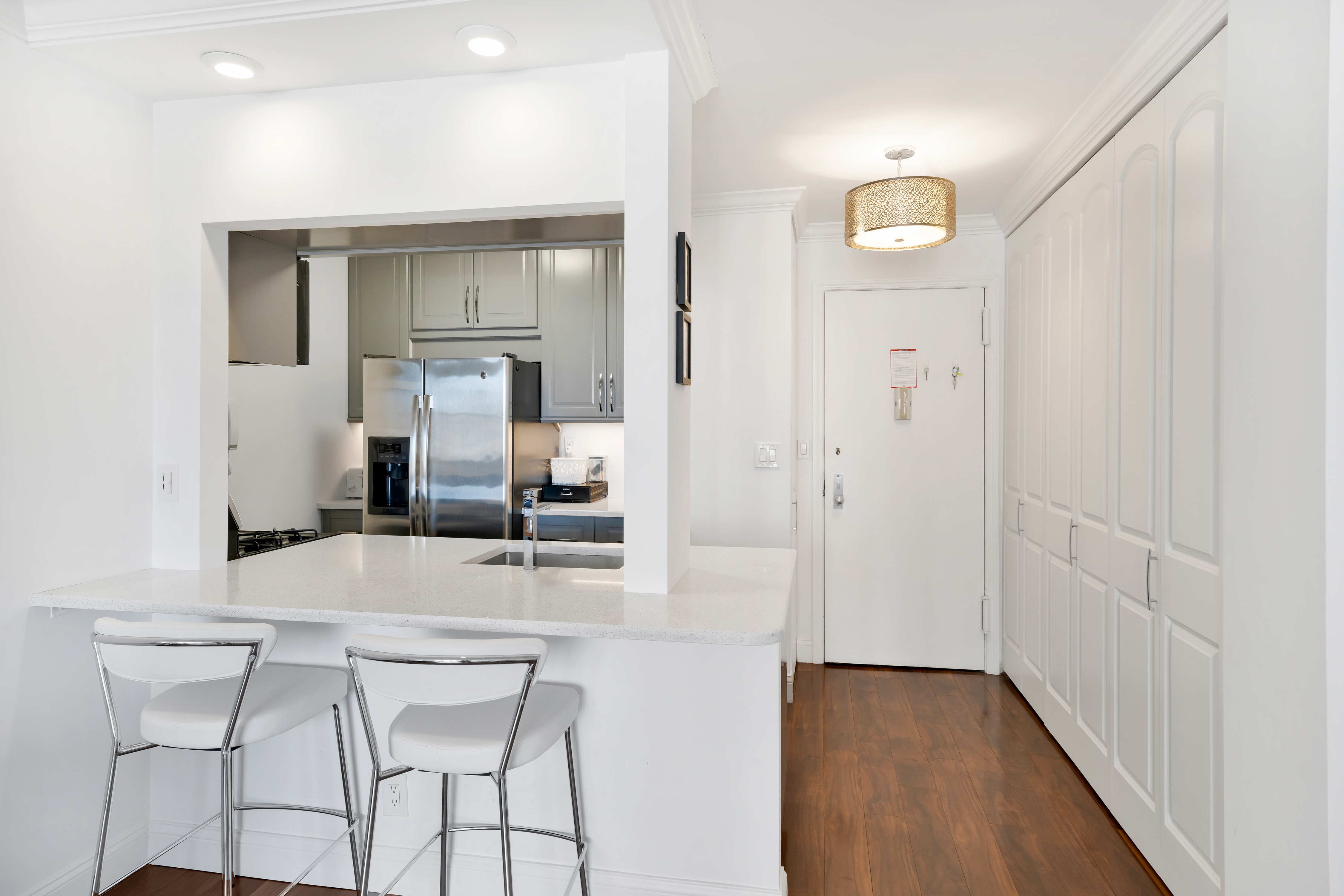 400 East 54th Street, Unit 26D Manhattan, NY 10022 - Photo 3 of 12 a bathroom with a sink and a mirror