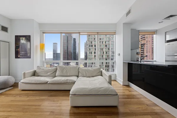 a living room with furniture and a large window