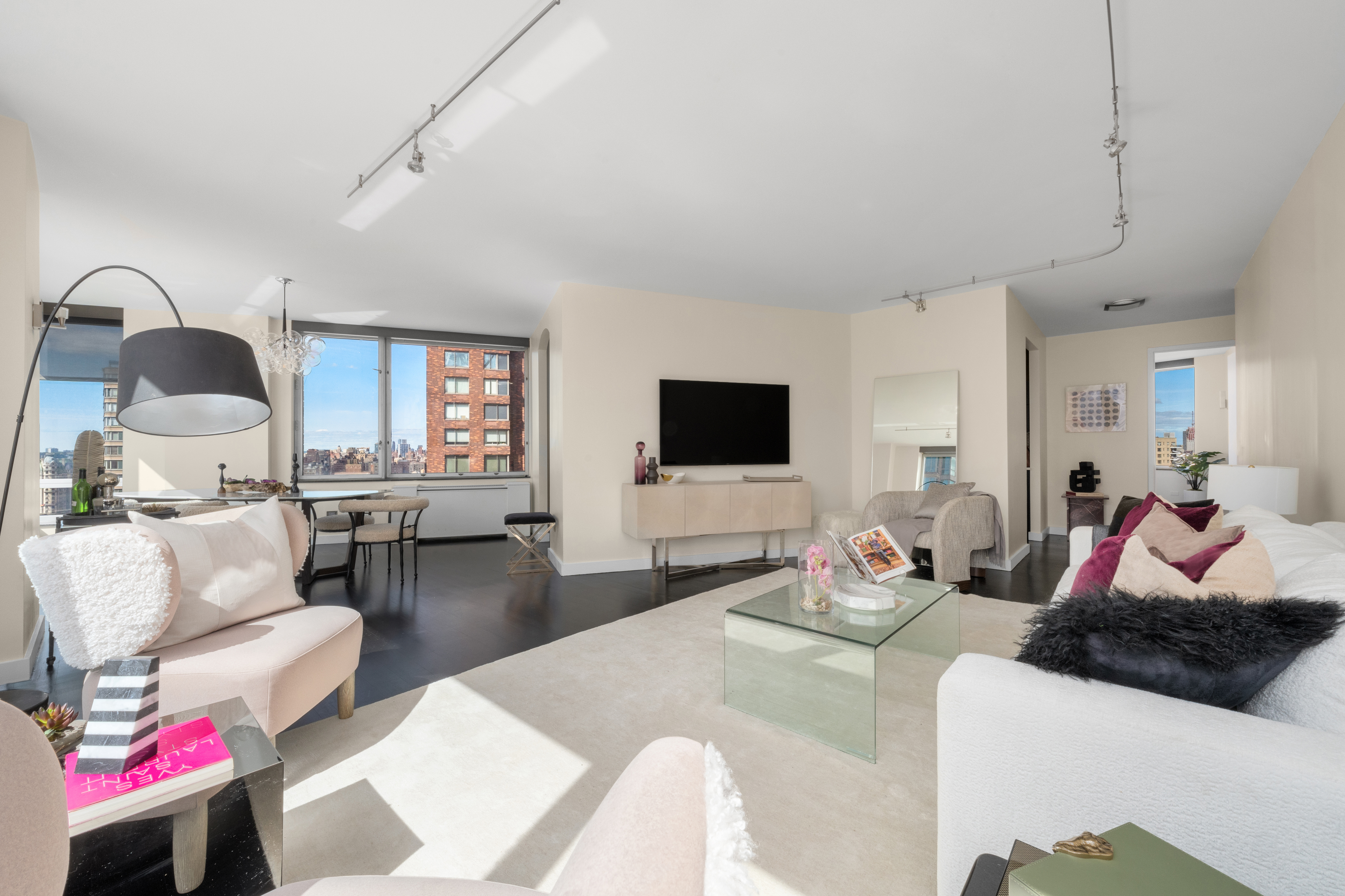 150 Columbus Avenue, Unit 22A Manhattan, NY 10023 - Photo 3 of 23 a living room with furniture and a flat screen tv