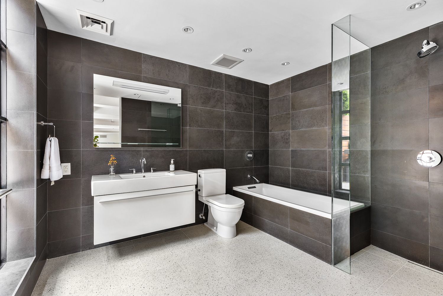 60 Collister Street, Unit 4A Manhattan, NY 10013 - Photo 15 of 21 a bathroom with a sink a toilet and shower